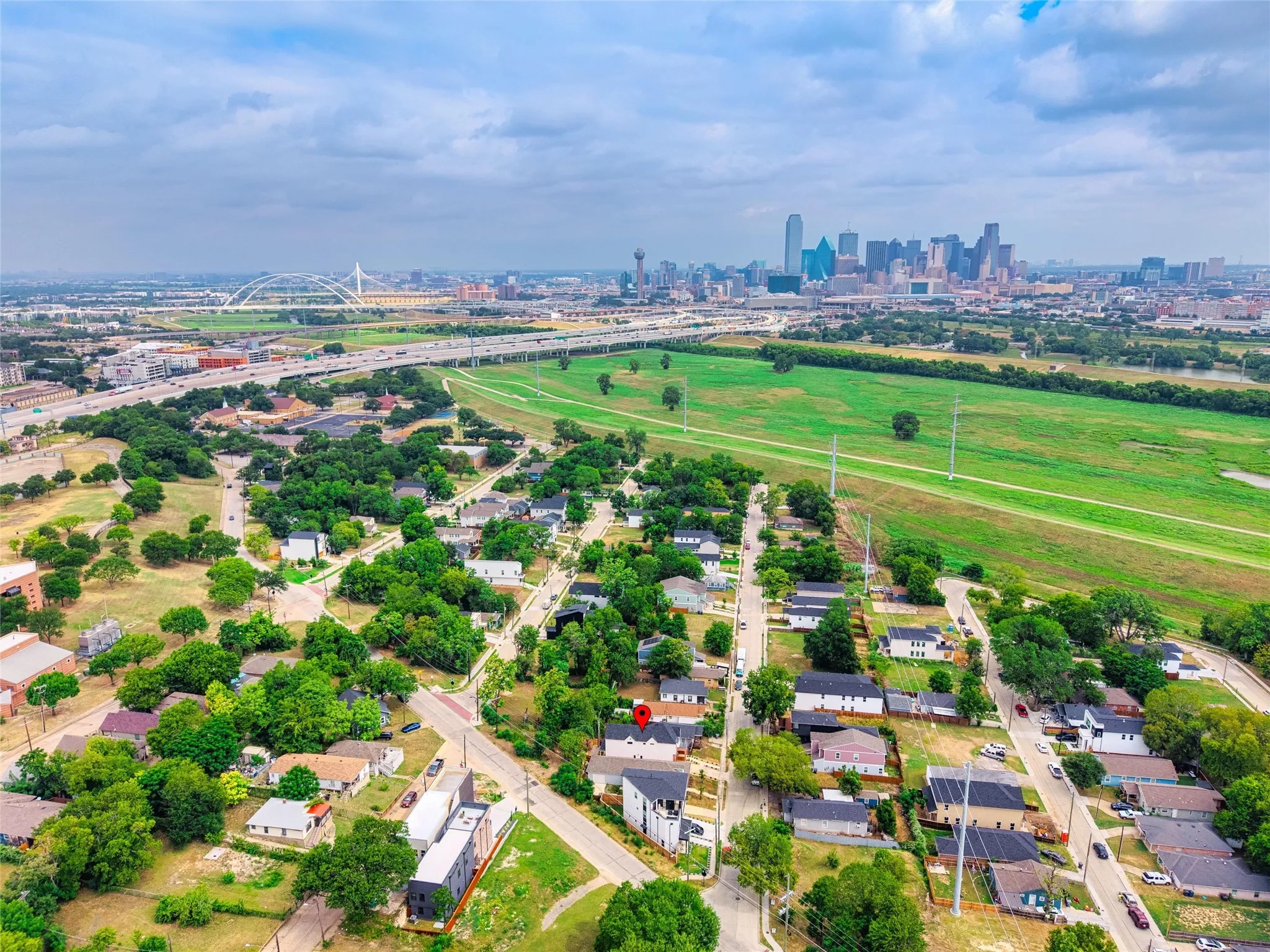 Aerial perspective showcasing a residential neighborhood with a distant cityscape