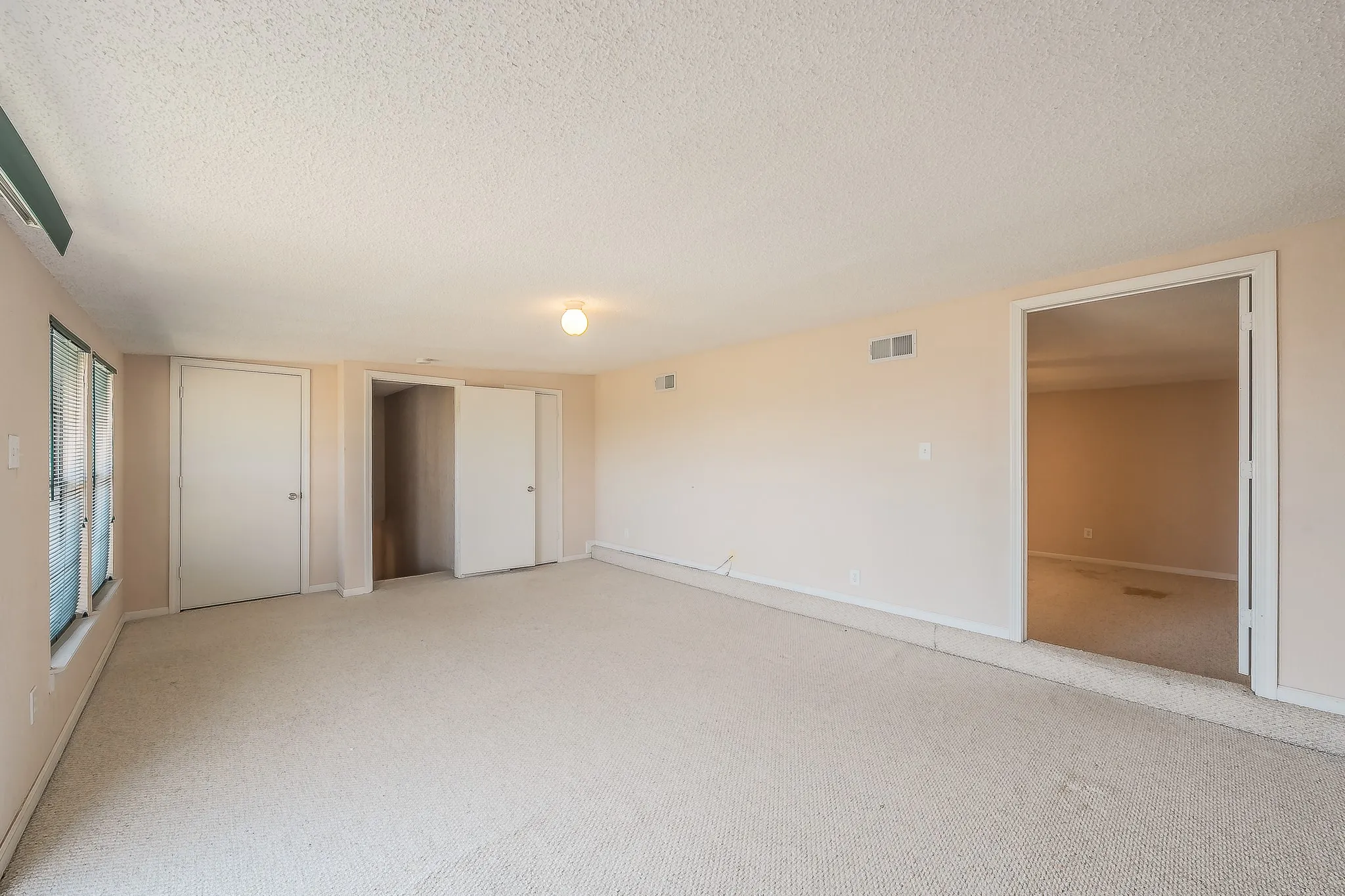 Upstairs room with bedroom and en suite bath to the right