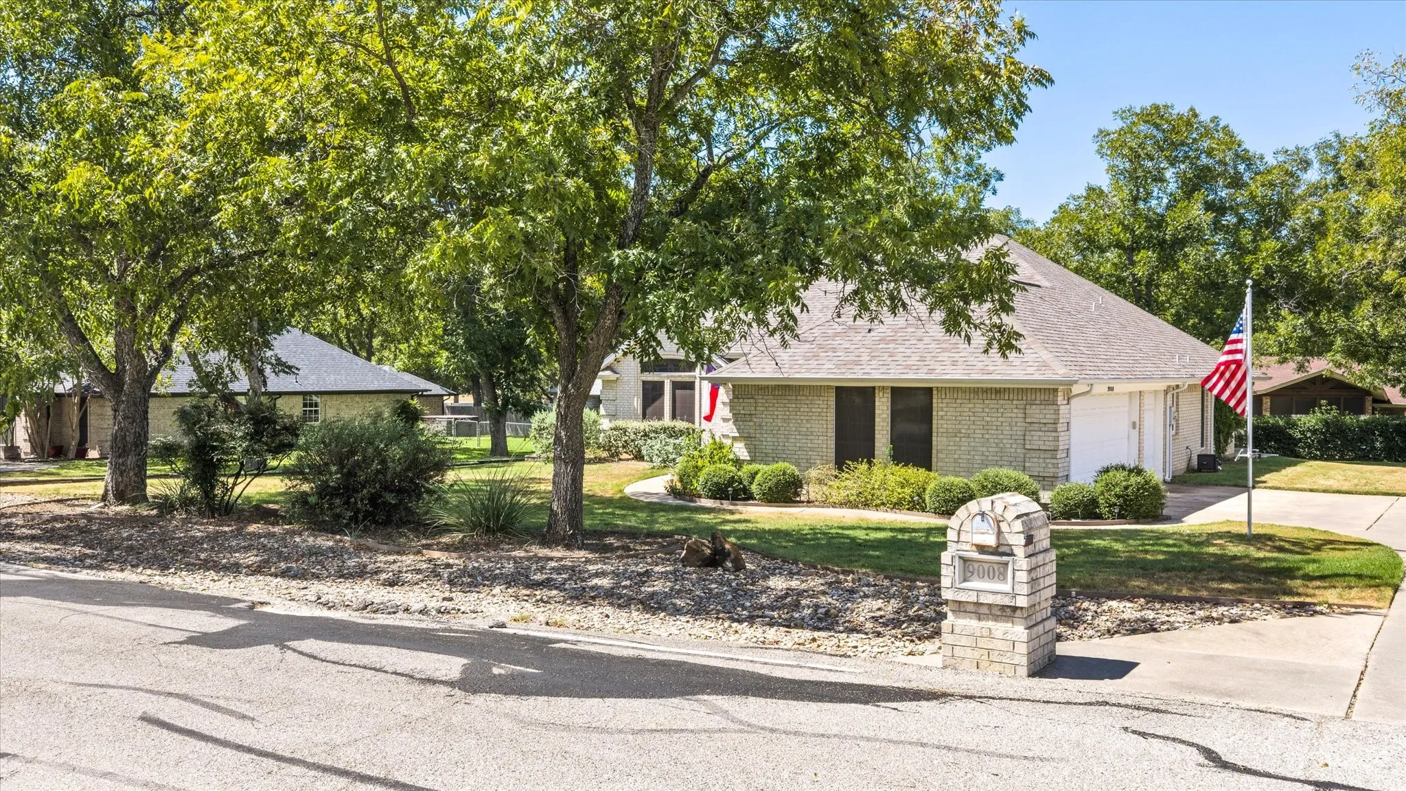 Single-story brick exterior with an attached two-car garage