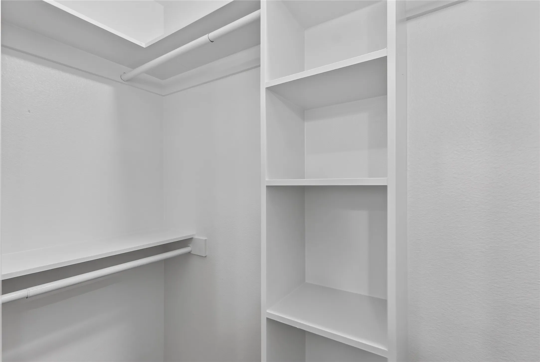 Built-in shelving and hanging rods for organized storage