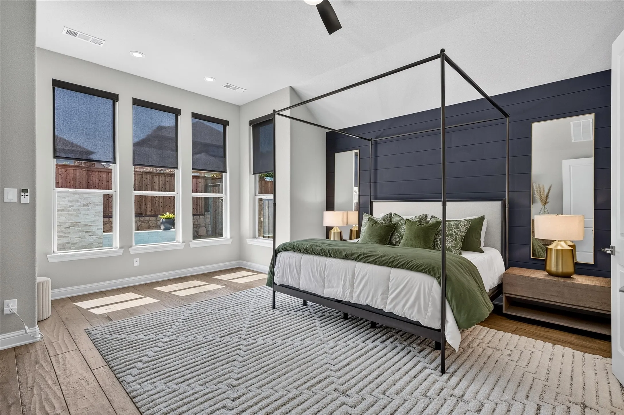 Vaulted ceiling with a black ceiling fan