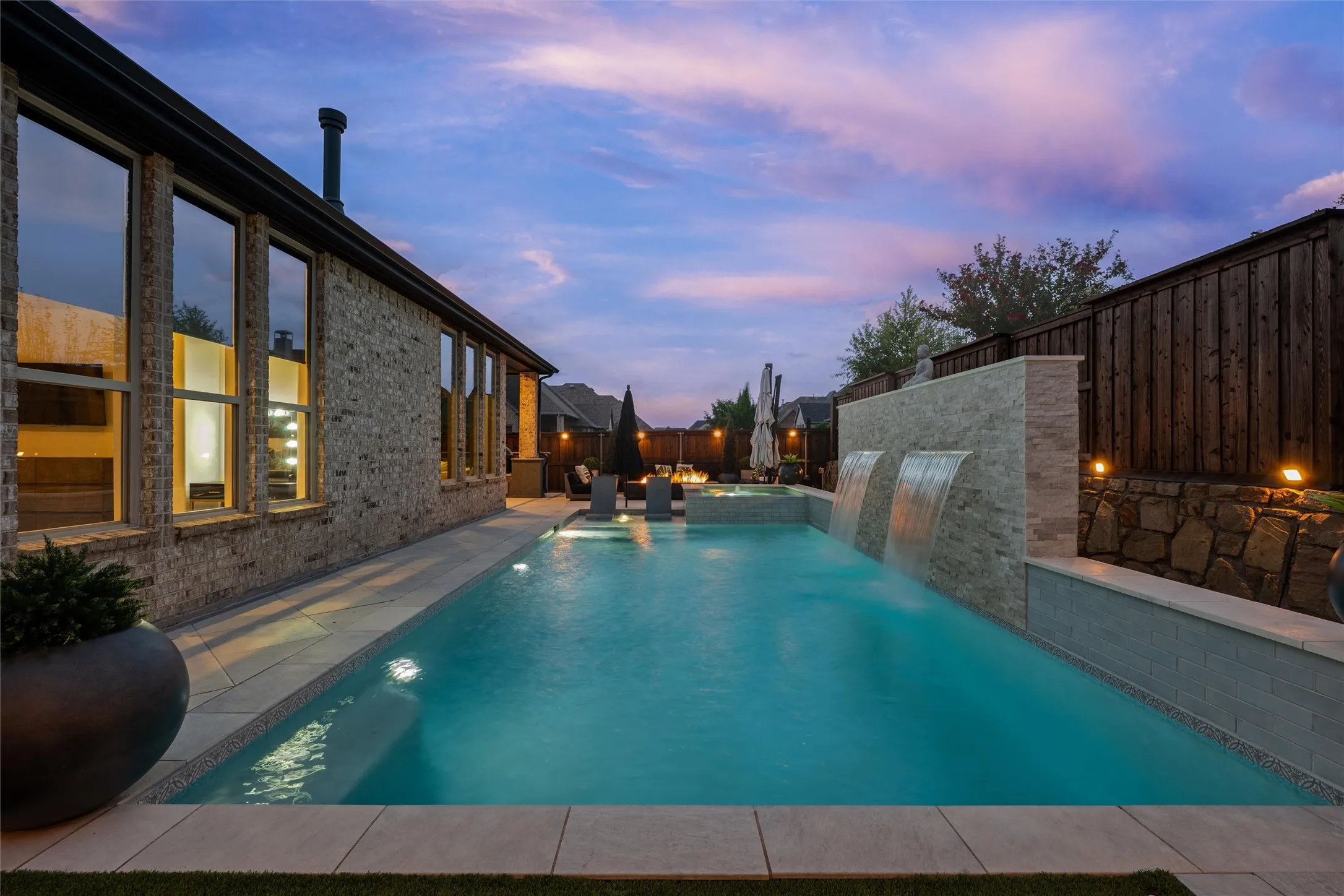 Exterior brick facade featuring multiple windows