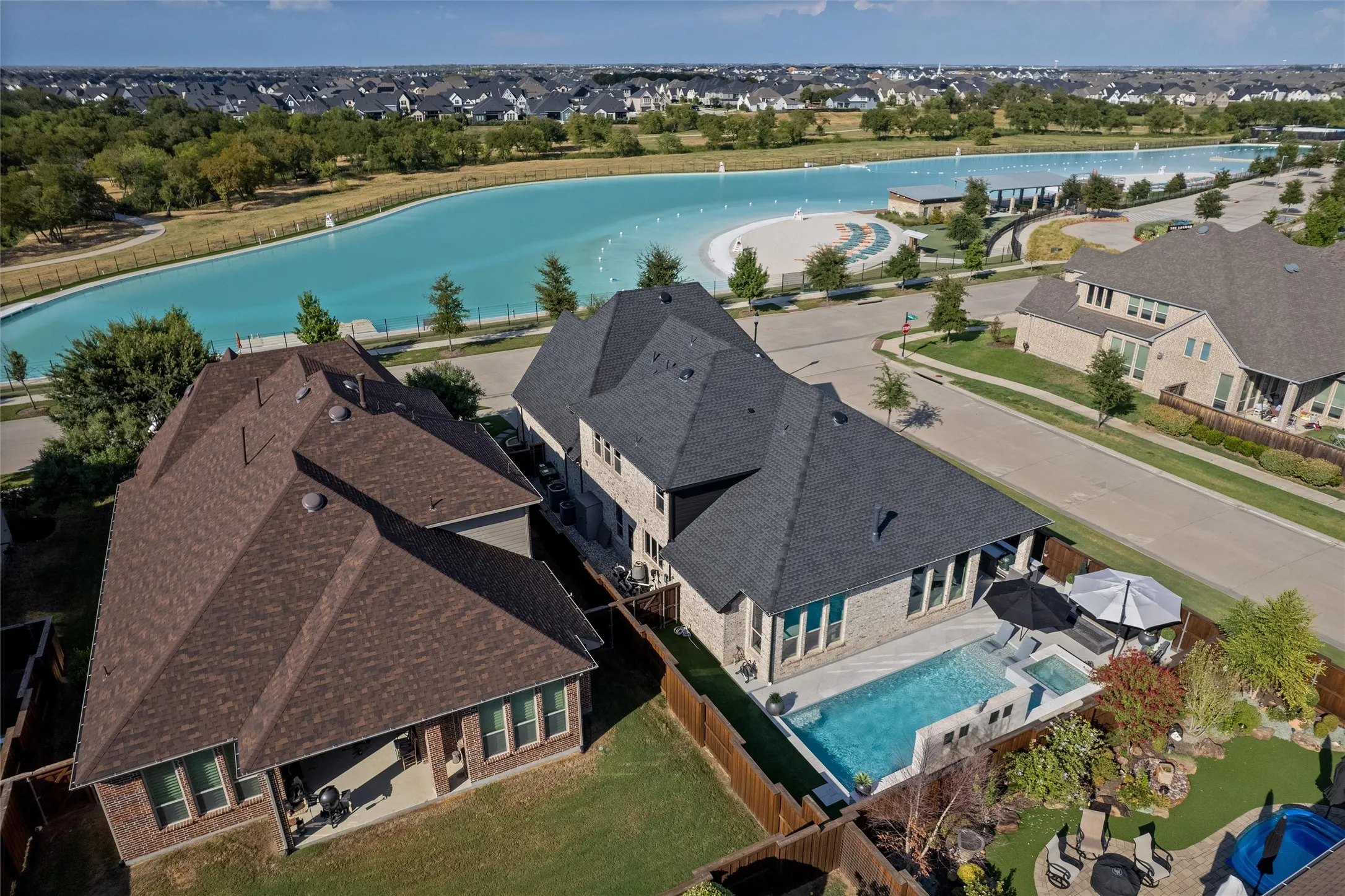 Private backyard with an integrated swimming pool and spa