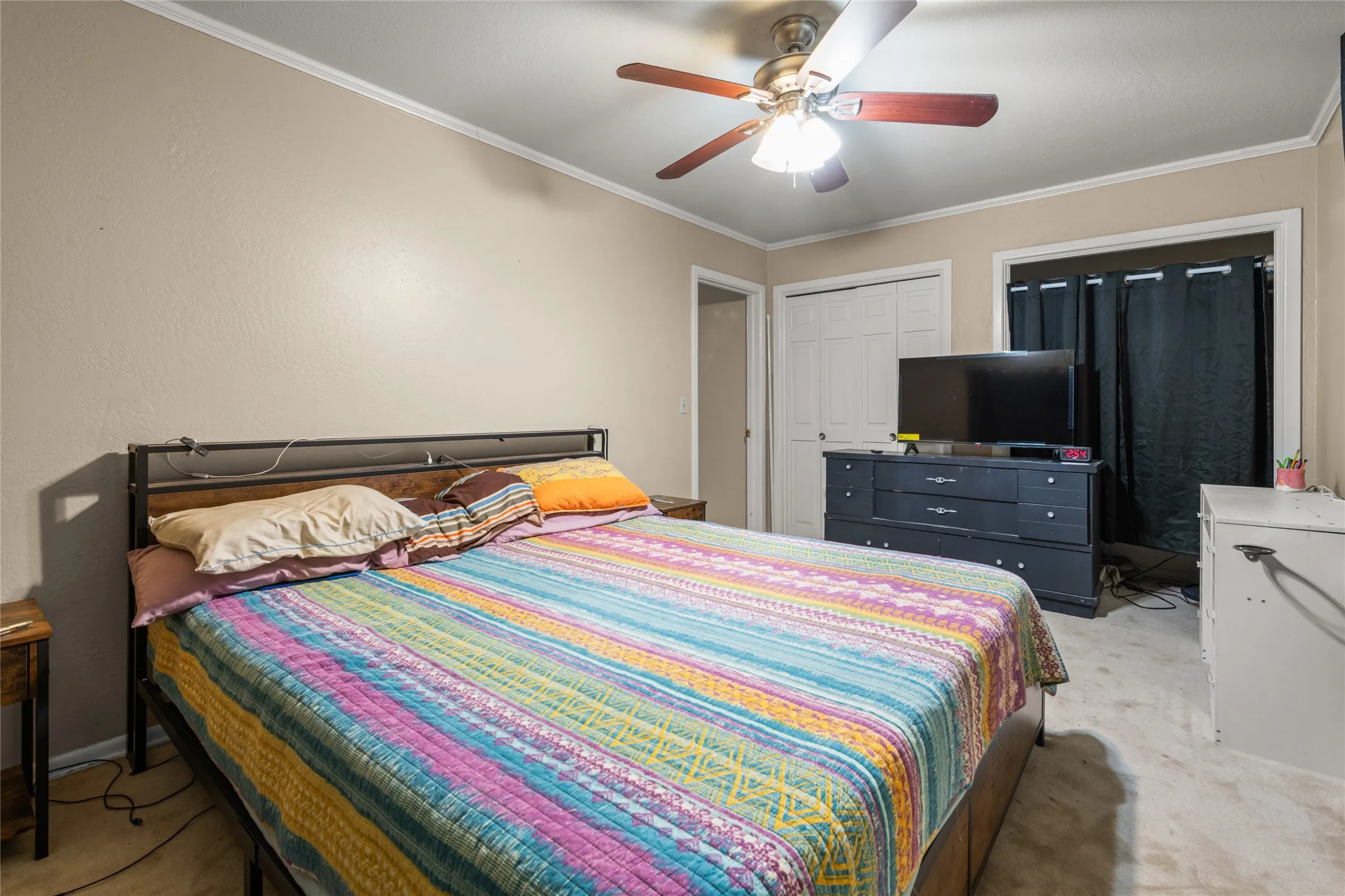 Recessed lighting, ceiling fan with light fixture, and crown molding