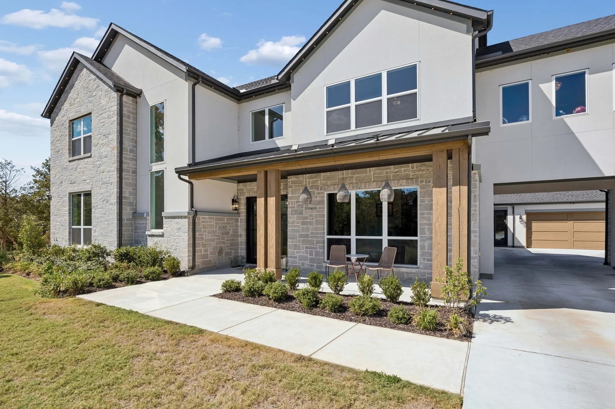 Contemporary exterior featuring stone and stucco finishes