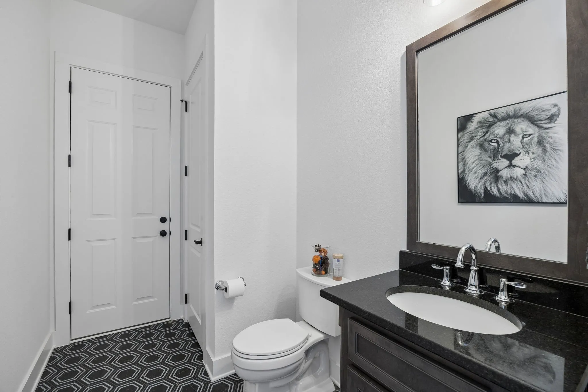 Dark stone-finish vanity with an undermount sink and chrome fixtures