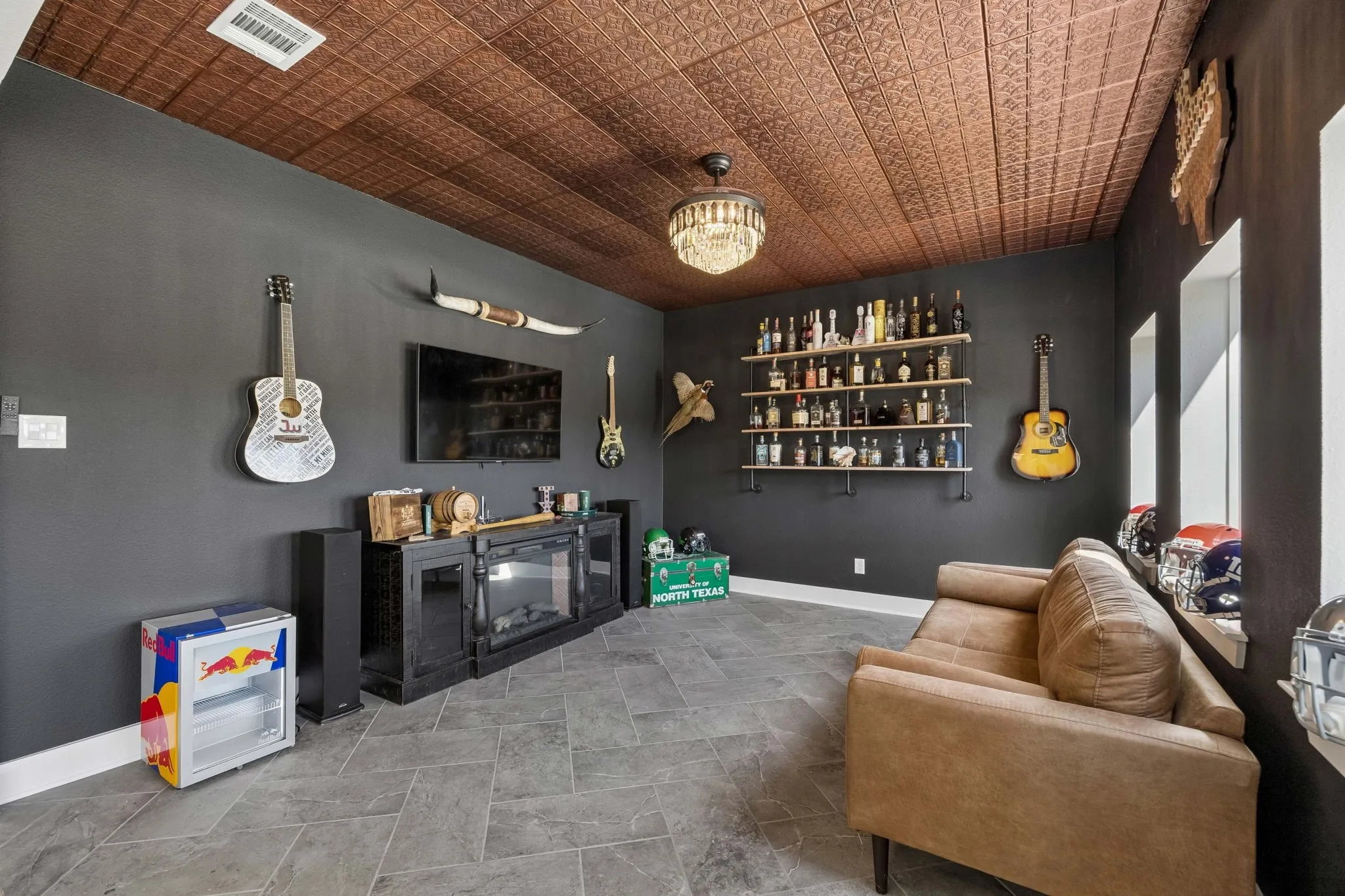 Textured ceiling, recessed lighting, chandelier, multiple windows, tile flooring