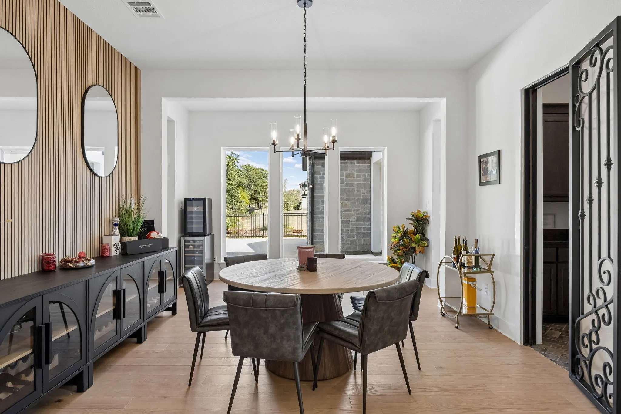 Light wood-finish flooring with a wood-slat accent wall