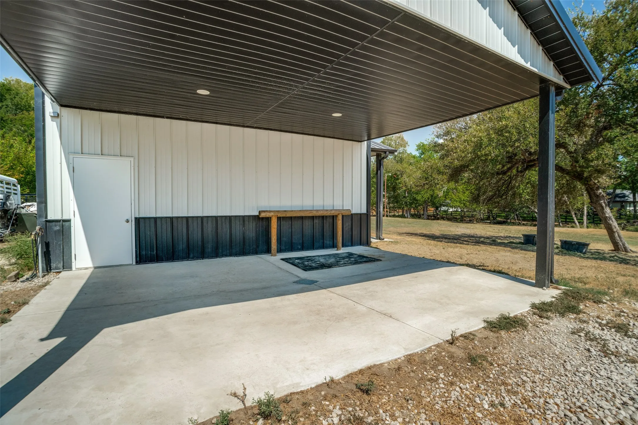 Large covered area includes wash rack area.