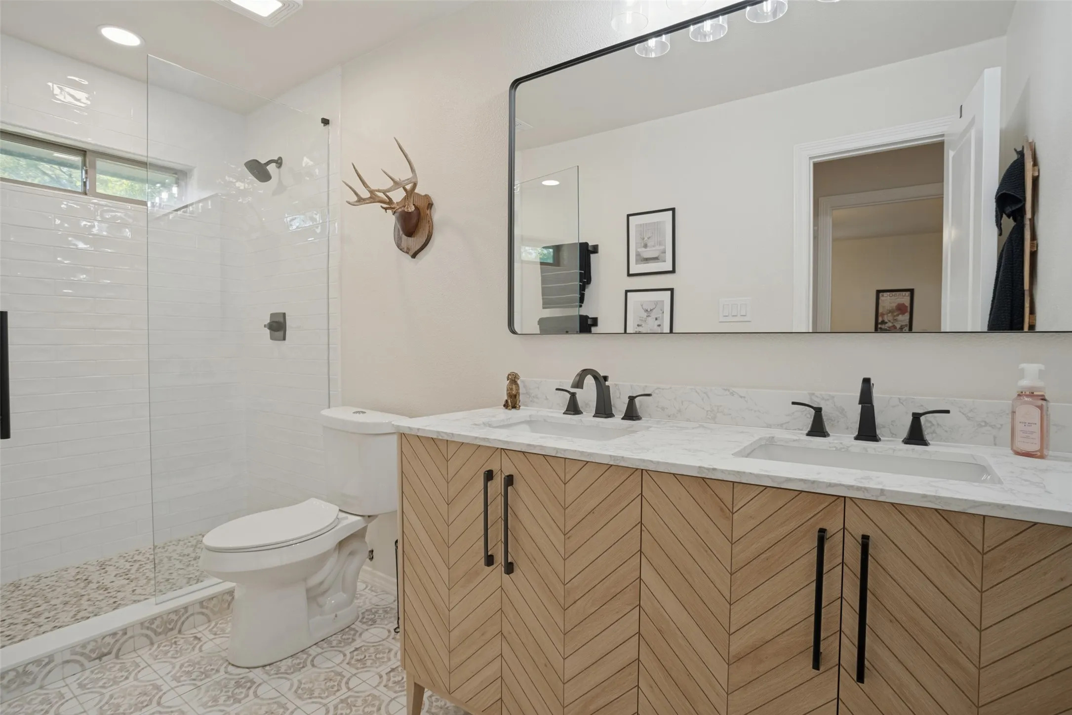 Secondary bathroom has been tastefully remodeled.