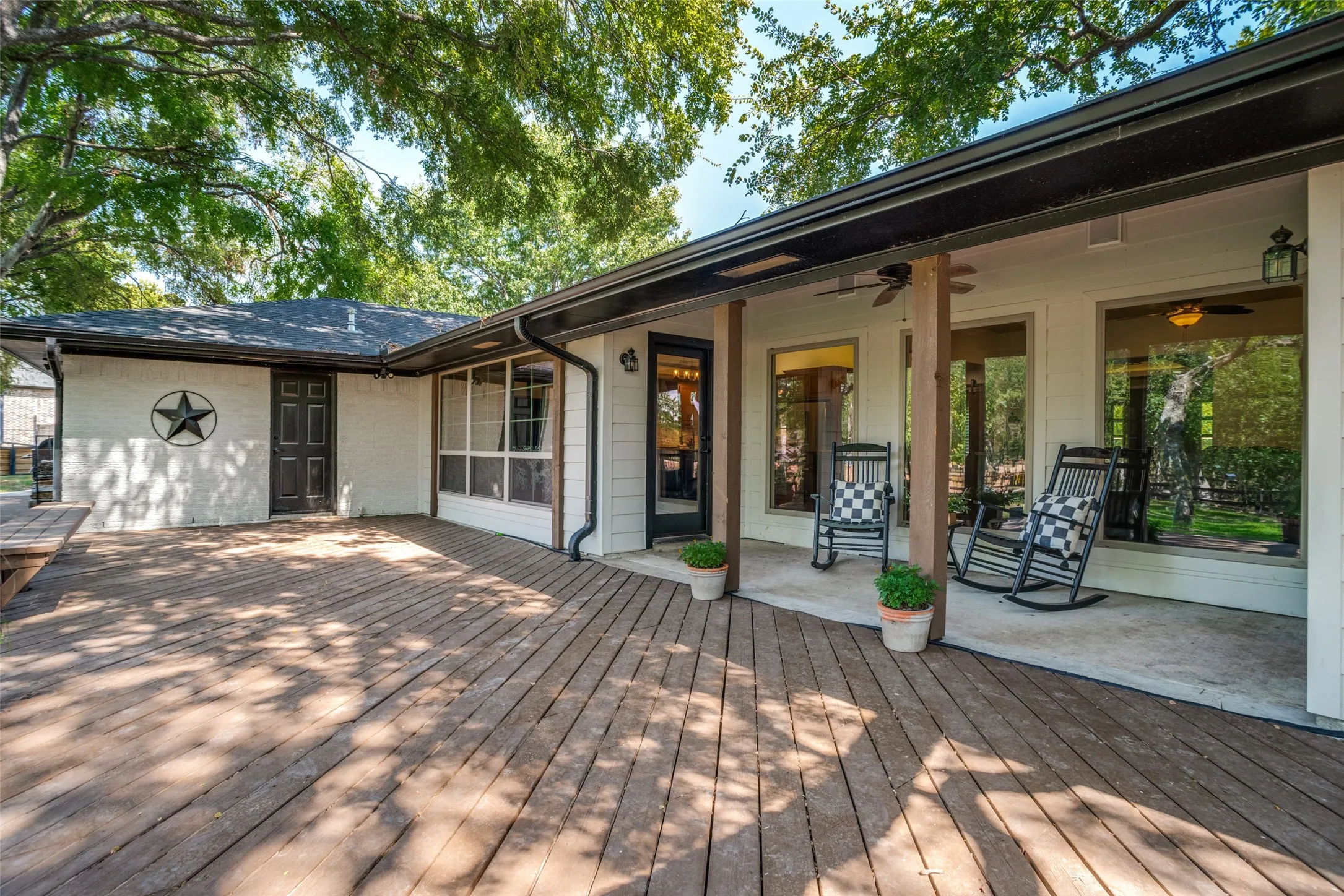 The large deck spans the entire back side of the home and provides plenty of space for entertaining, grilling, etc.