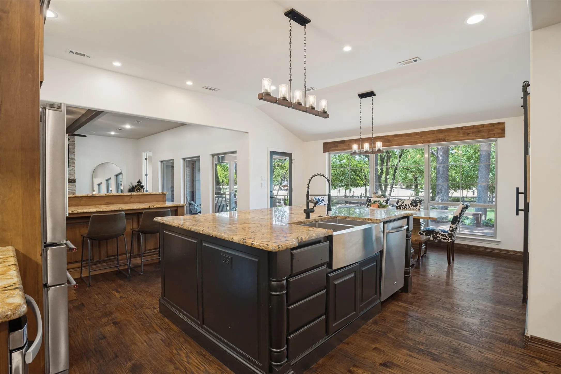 The kitchen is an entertainer's dream.  Plenty of space for a large family or guests.  Granite countertops, extra deep stainless steel sink, custom lighting, breakfast bar area.