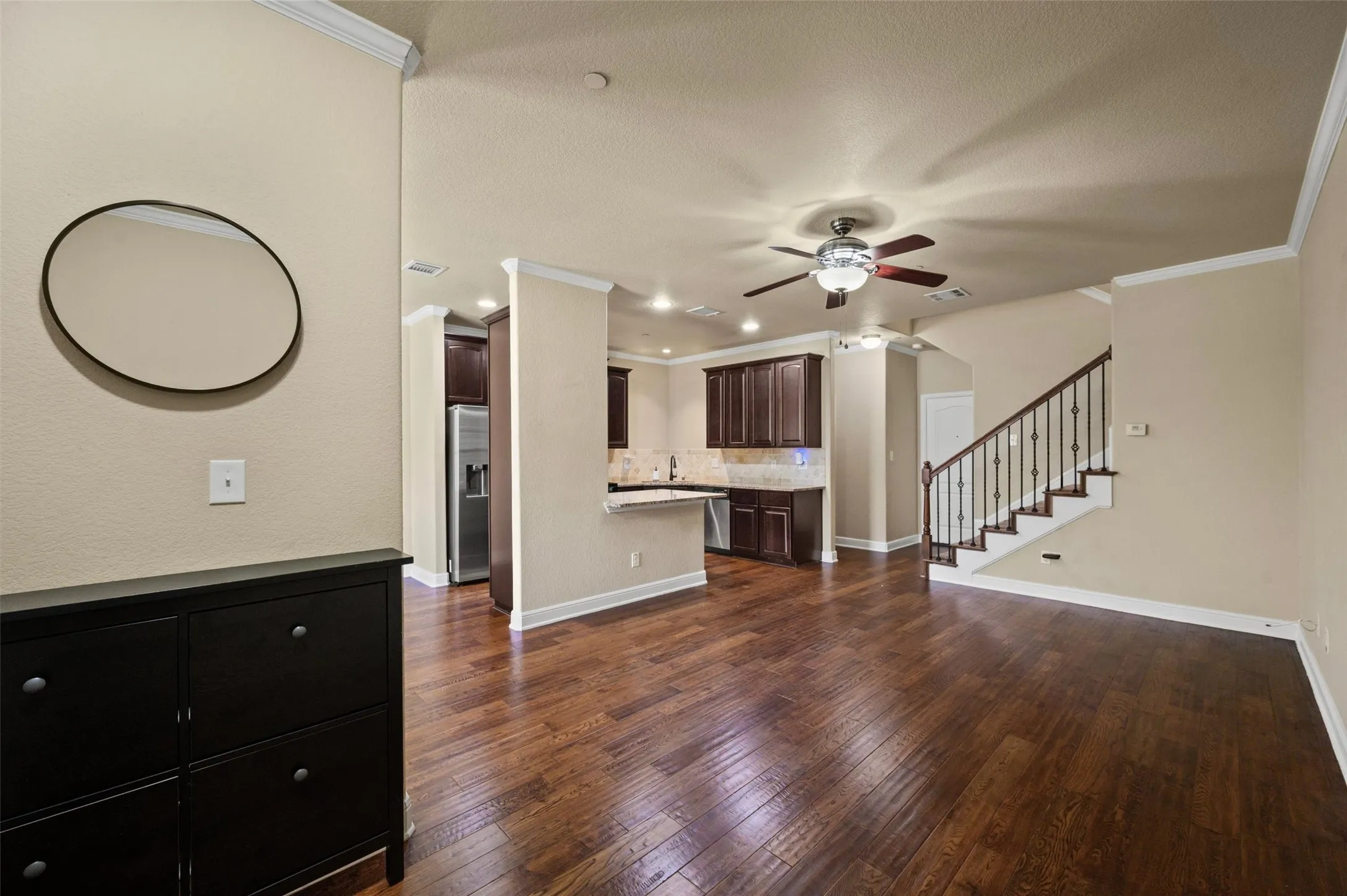 Rich wood-finish flooring throughout the main level