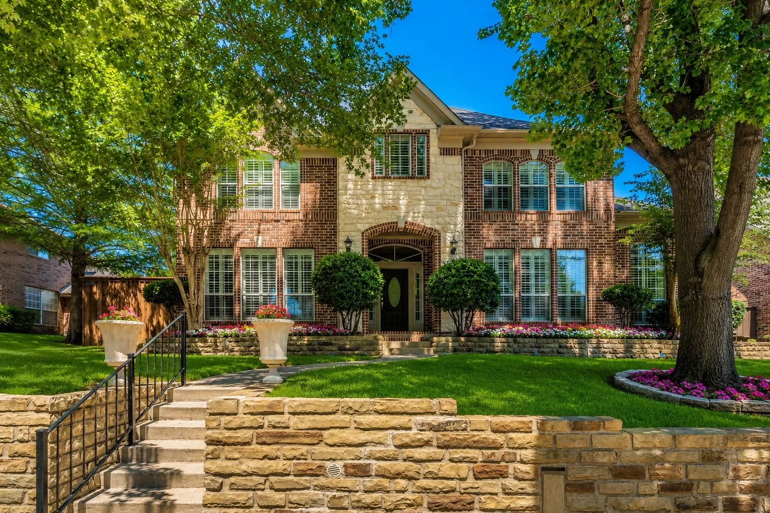 Brick and stone exterior with arched entryway