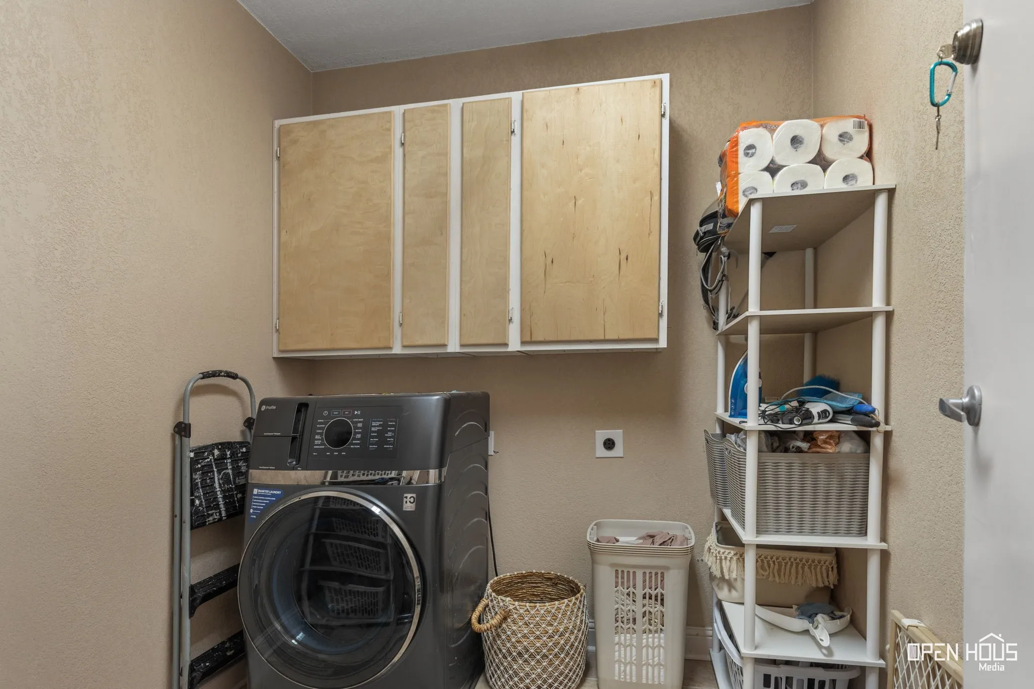 Built-in cabinetry providing overhead storage