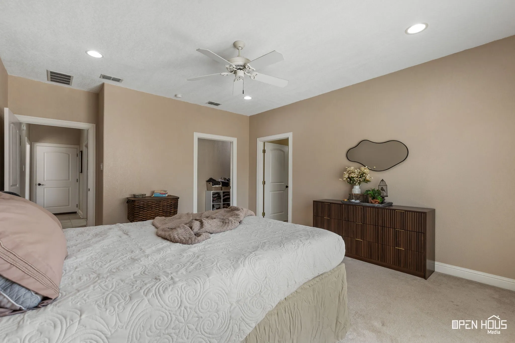 Recessed lighting, ceiling fan, neutral wall tones, and carpet flooring