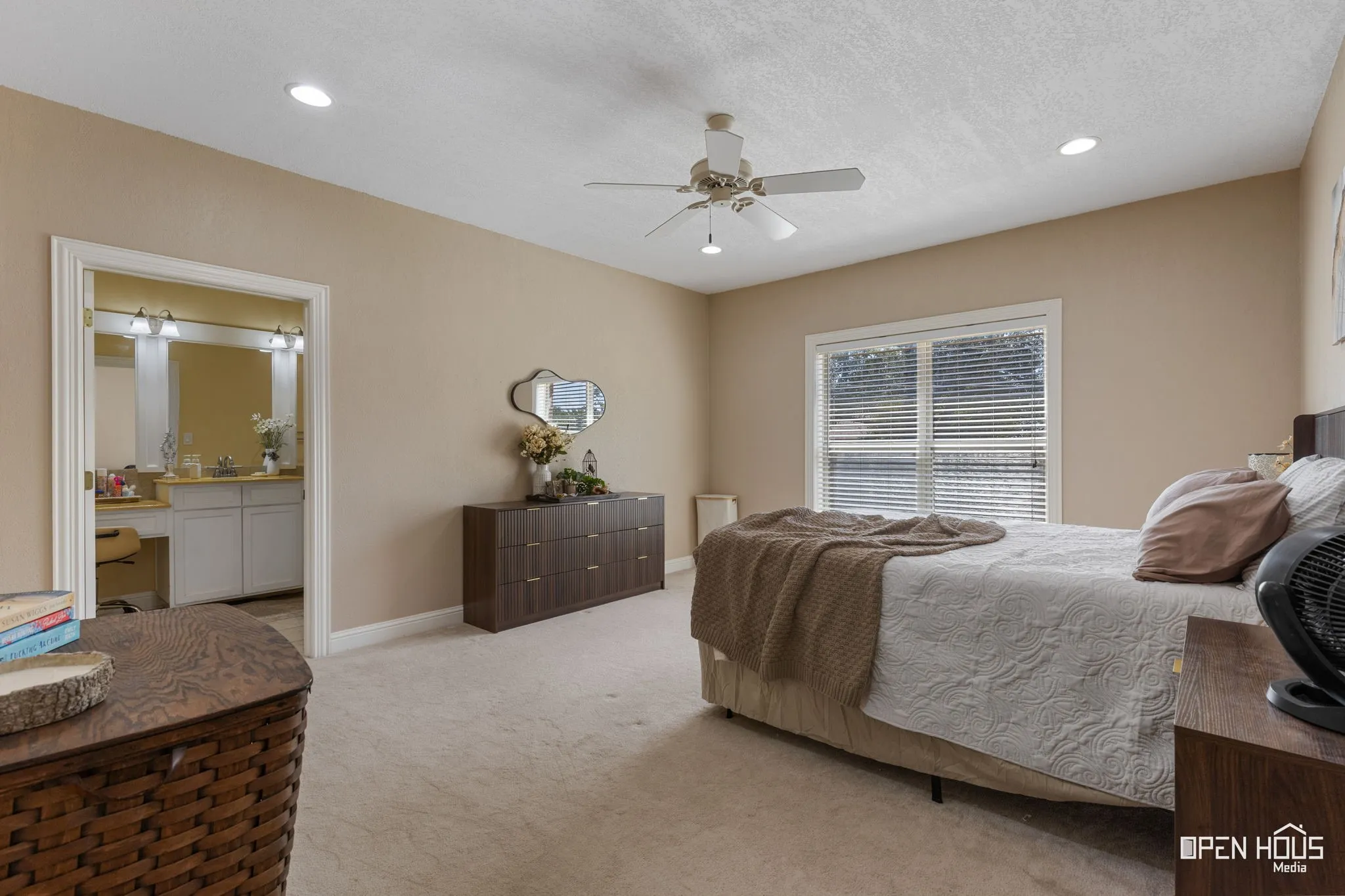 Recessed lighting, ceiling fan, and carpeted flooring