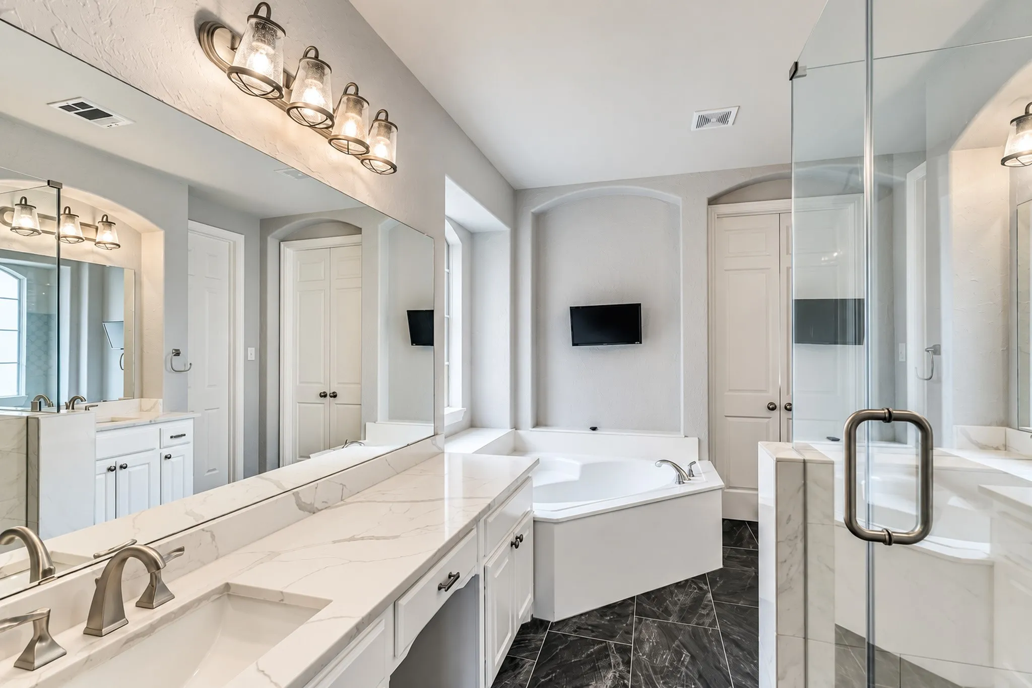 Dual vanity with undermount sinks and extensive countertop space