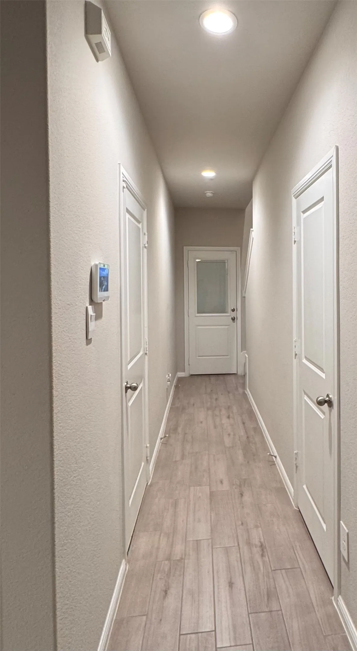 half bath, garage door entry, back yard patio at end