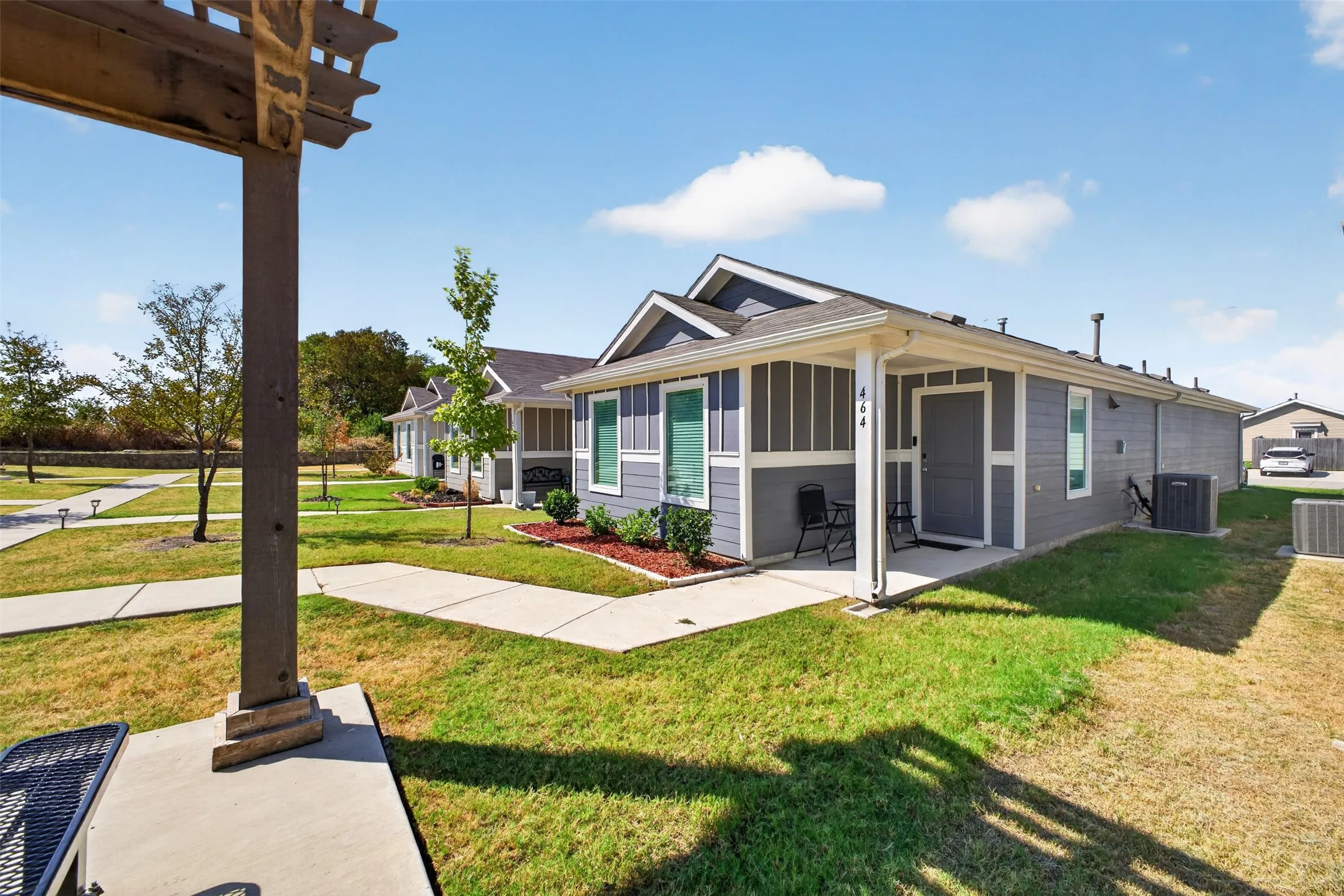 Contemporary gray siding exterior with white trim