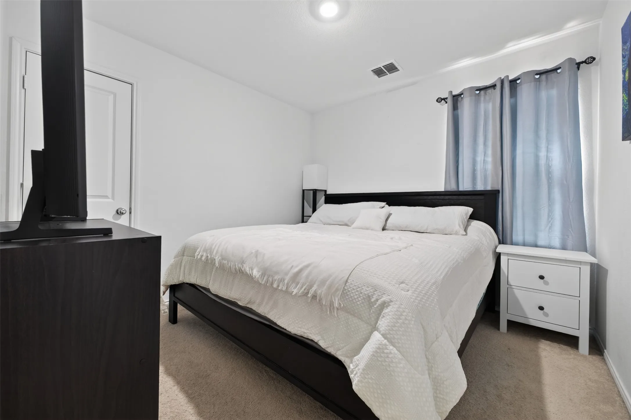 Clean white walls with recessed lighting