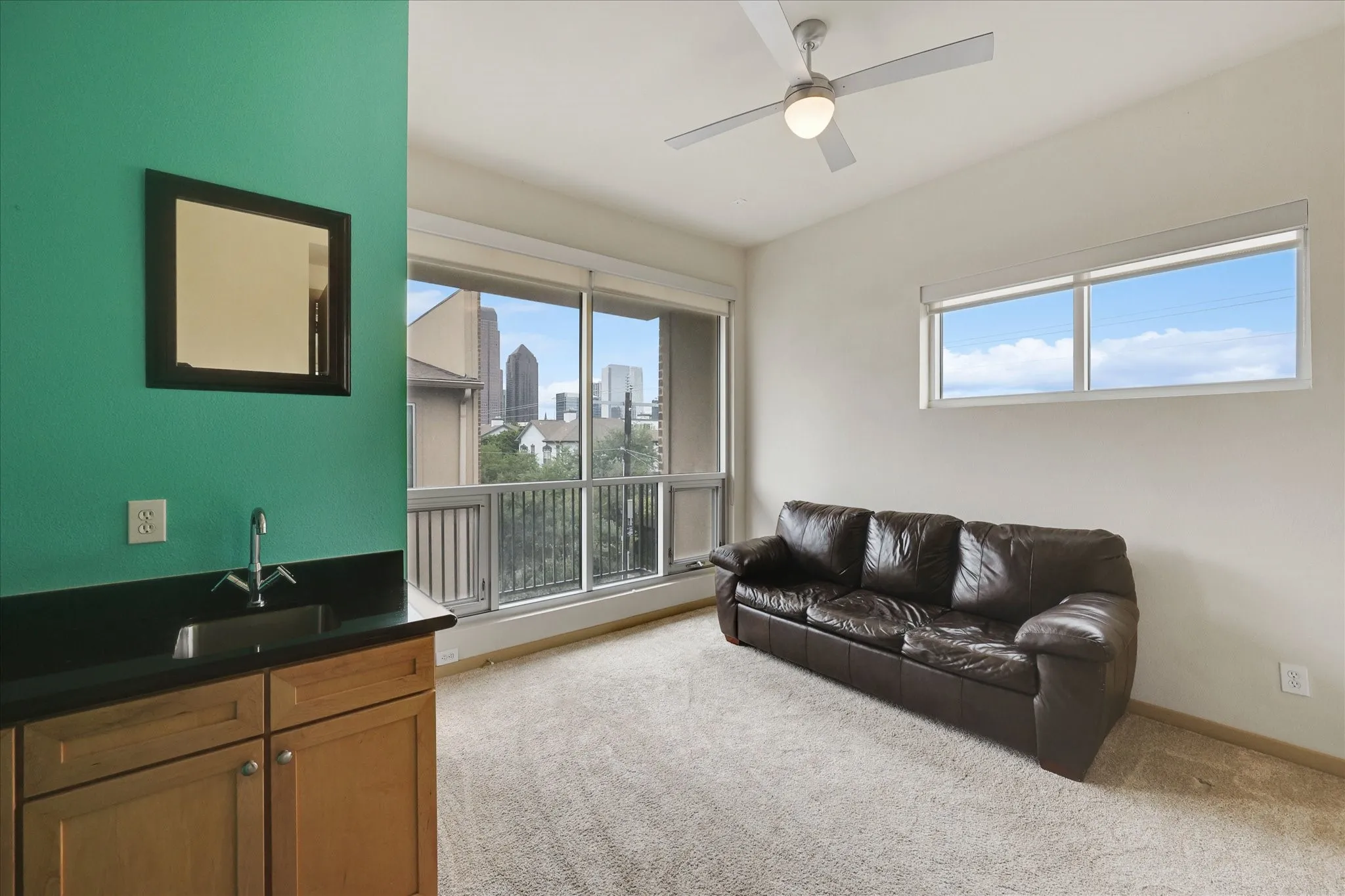 Loft space with wet bar located on 3rd floor adjacent to primary bedroom