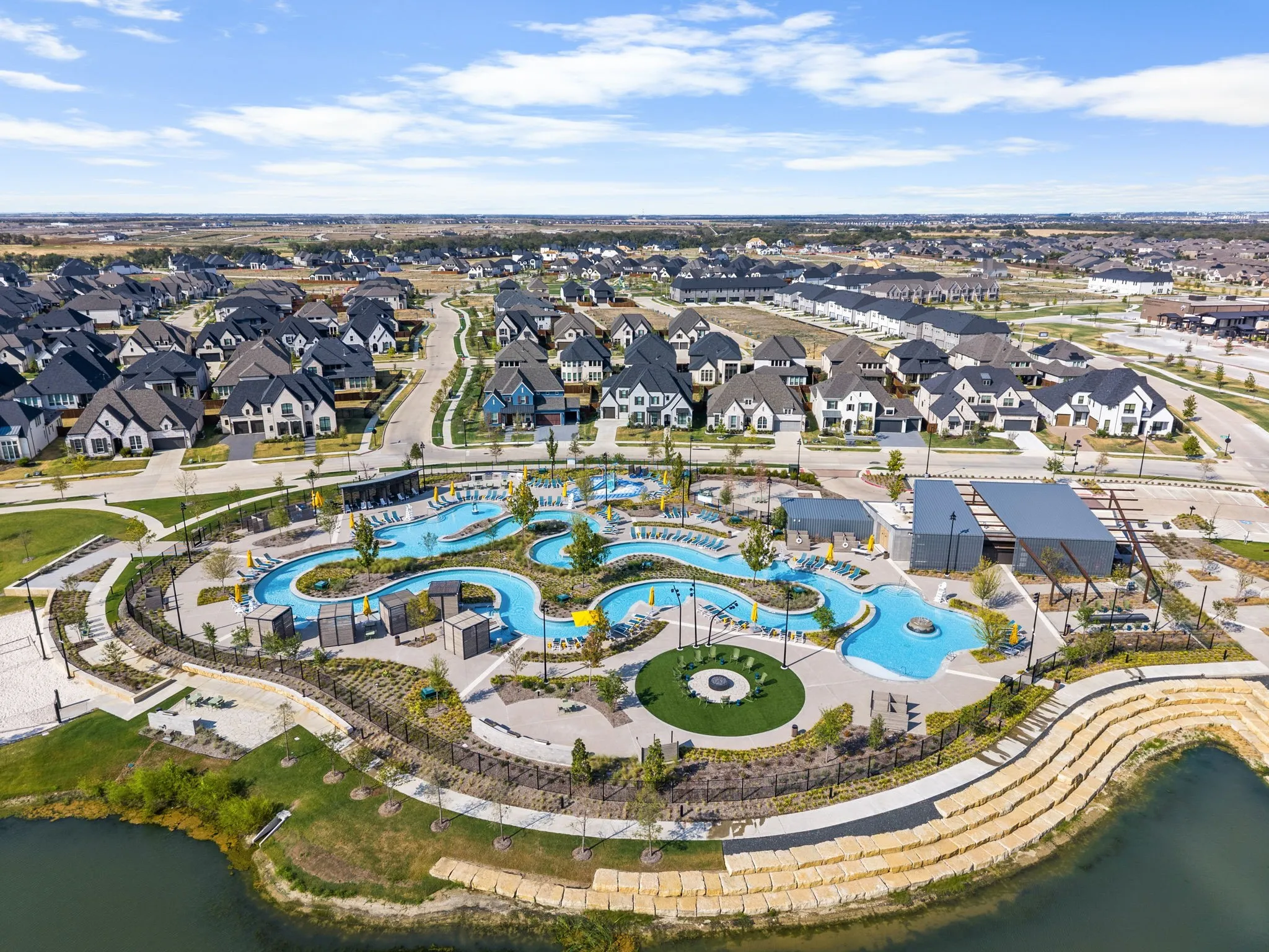 Community amenities featuring a resort-style pool, lazy river, and lounge areas