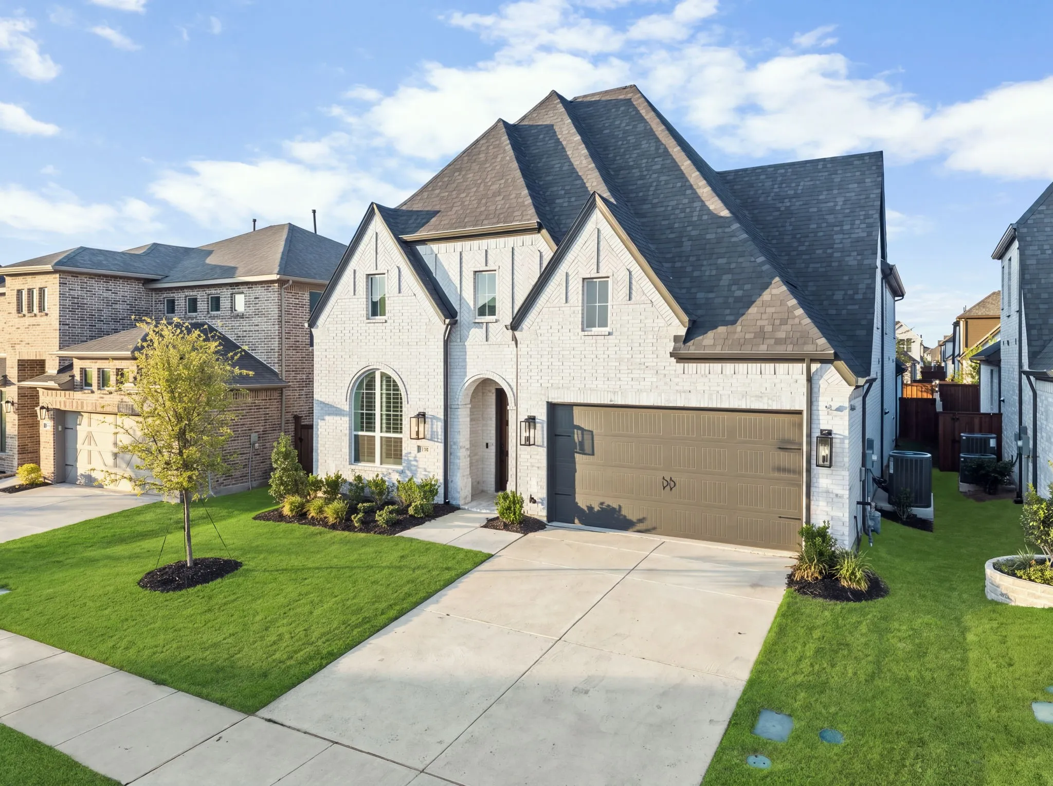 White brick exterior with dark trim accents