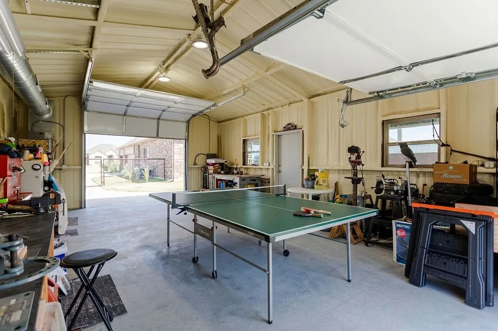 Virtually staged to show room for ping pong table