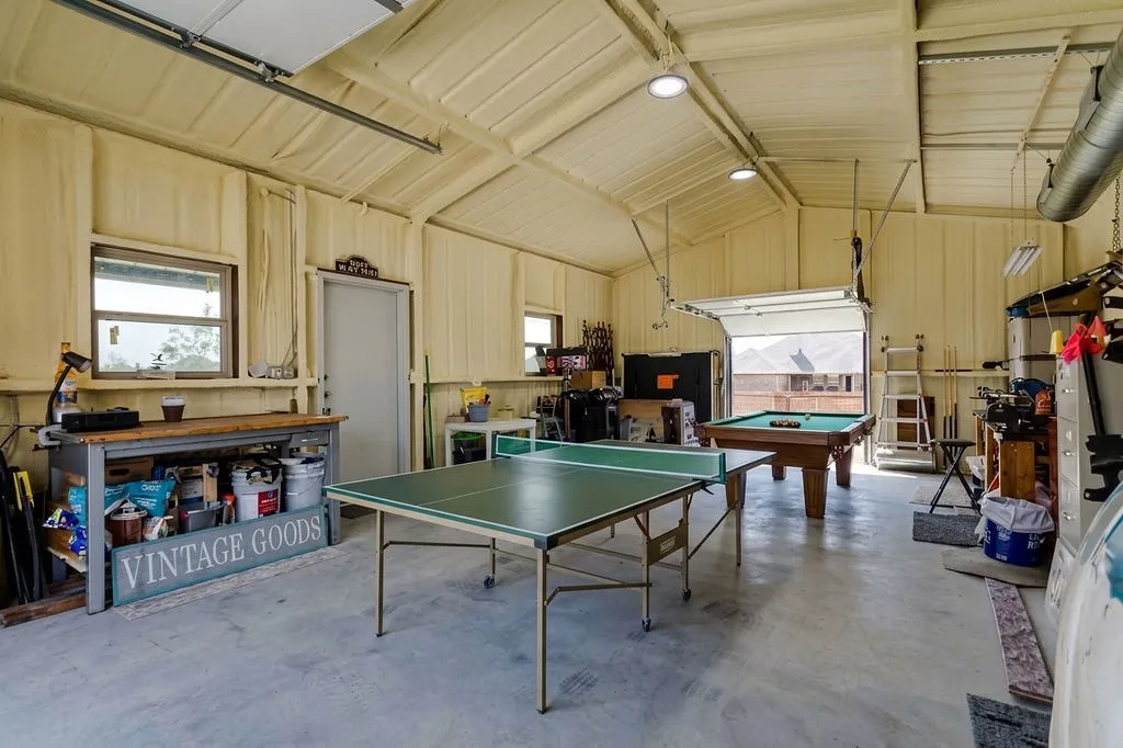 Virtually staged to sh ow room for pool table and ping pong table