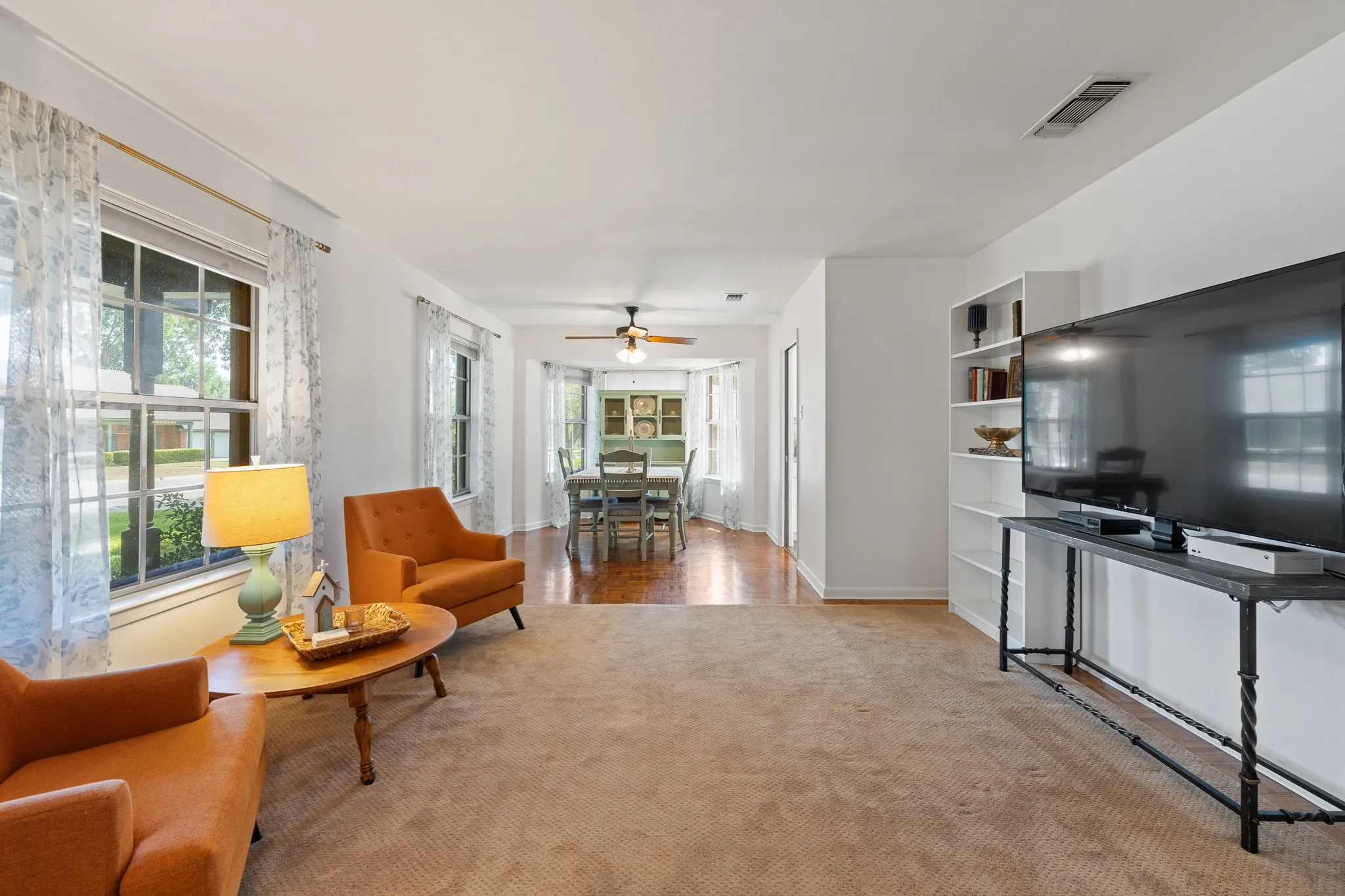Built-in shelving, recessed lighting, and wood-finish flooring