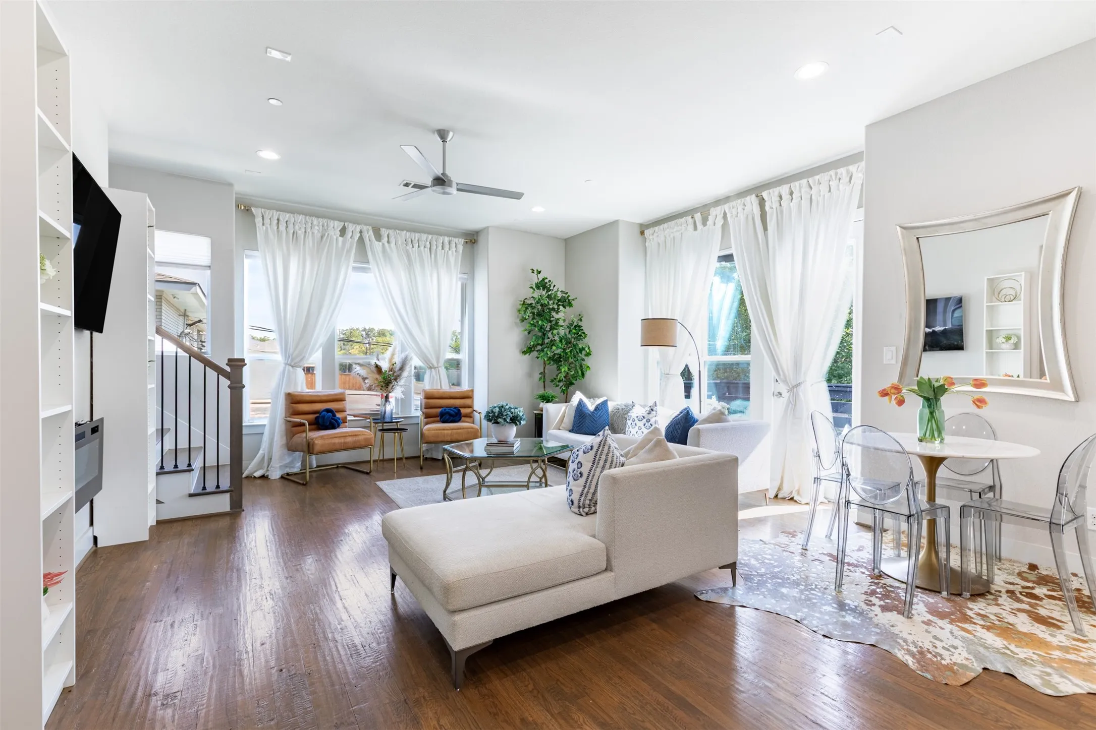 Open living room with natural light and gorgeous wood floors.