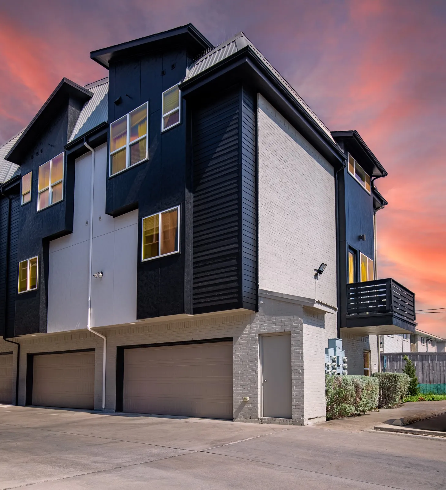 Complex at twilight.  Full 2 car garage