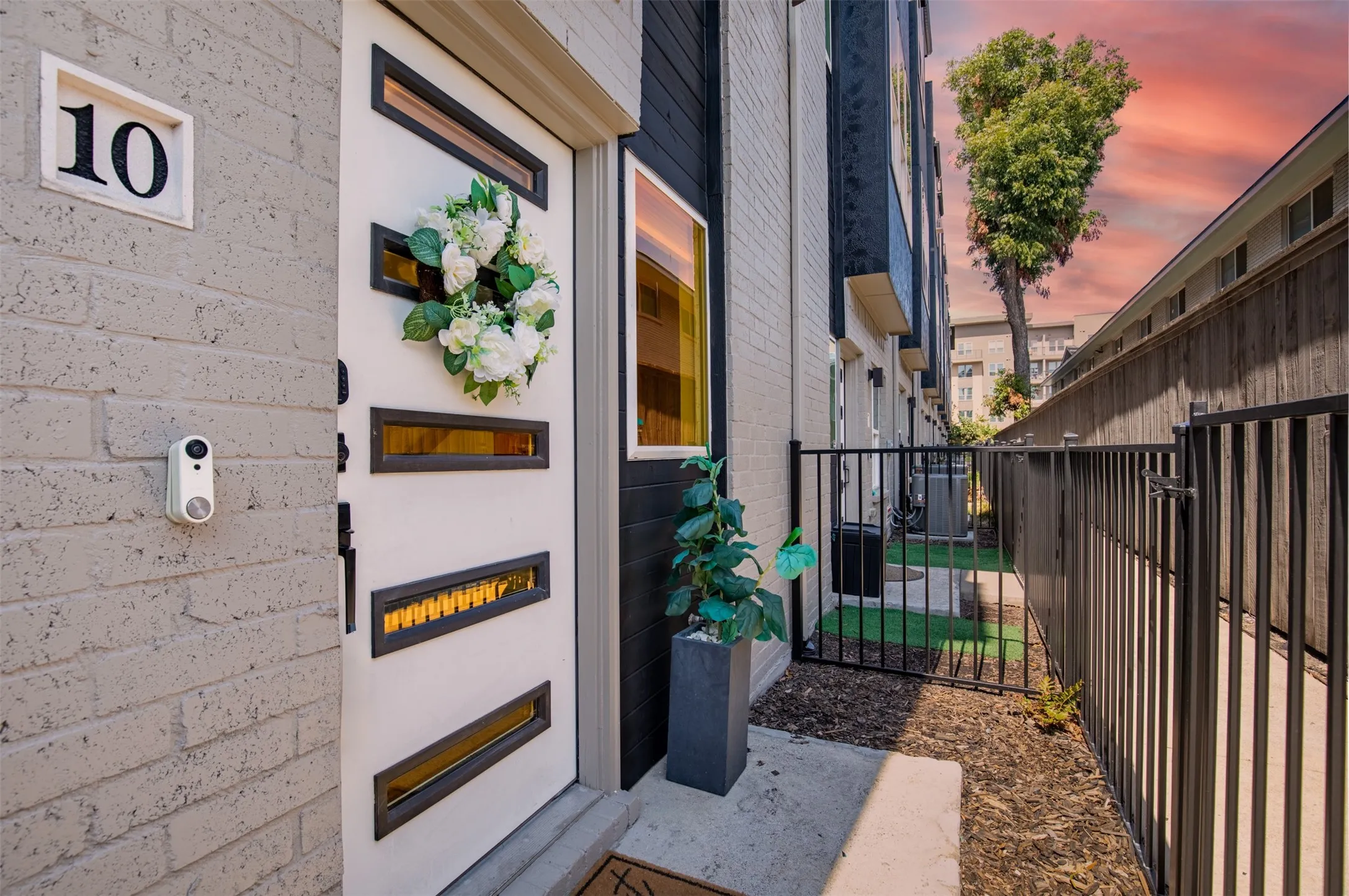 Small gated front yard at entry for pets.