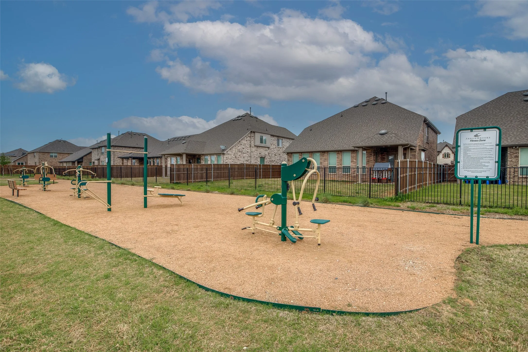 Outdoor fitness equipment on a textured ground surface