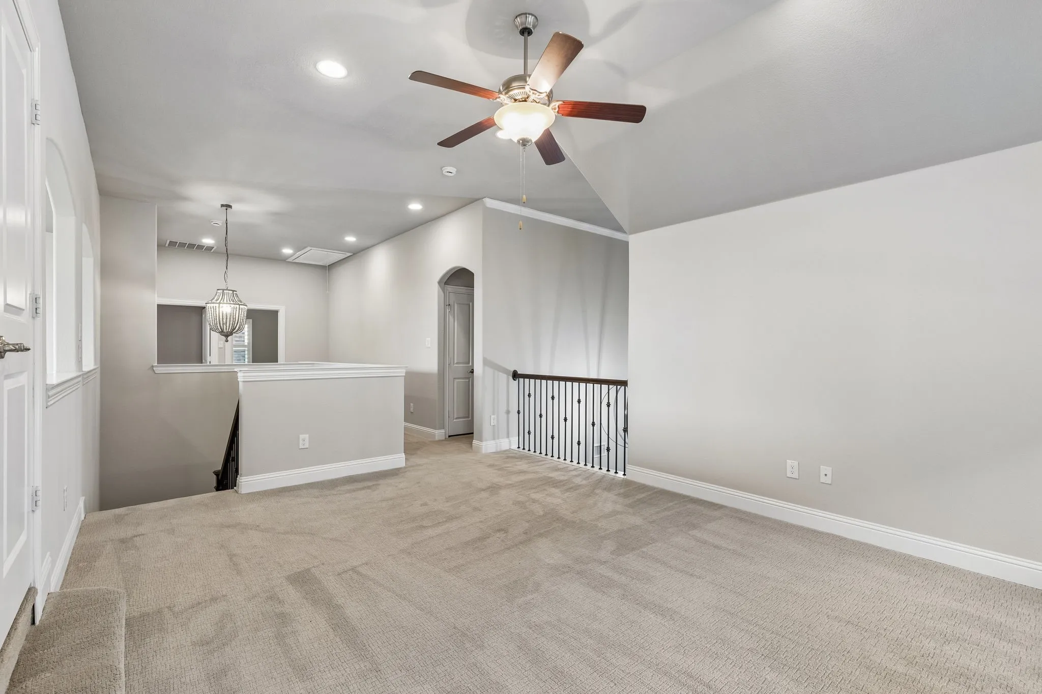 The expansive second-floor game room provides an additional living space with a built-in desk and cabinetry for homework, gaming or hobbies.