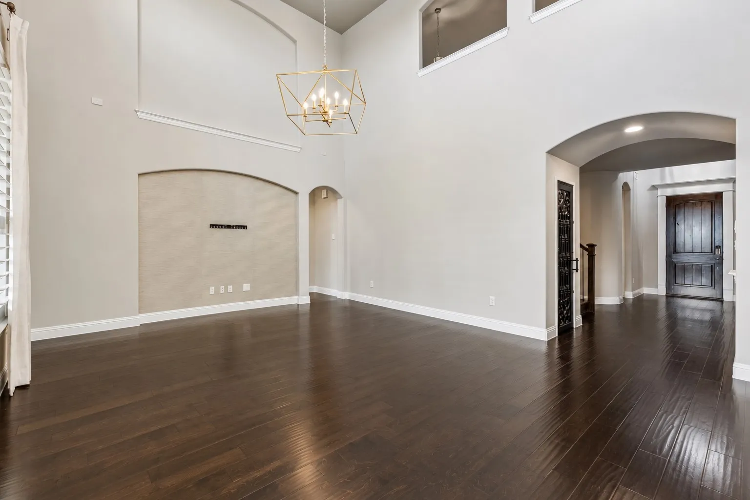 Freshly recoated hardwoods, a designer chandelier and Serena & Lily grasscloth detailing