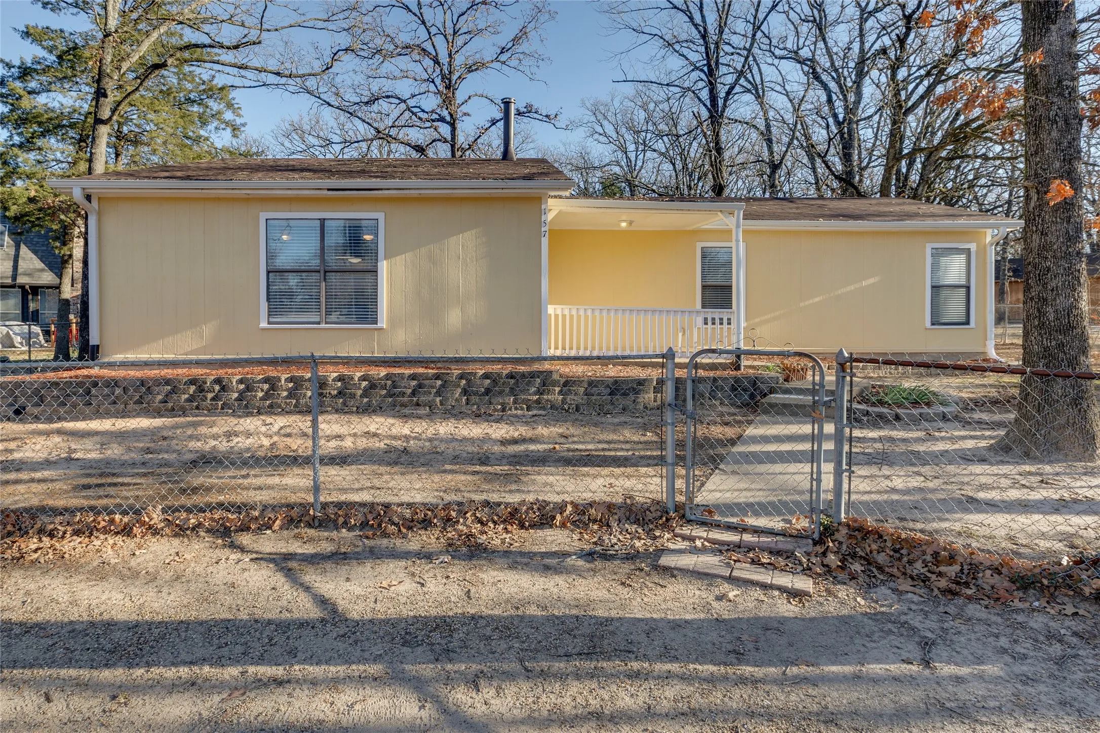 View of front of house with a gate and a fenced front yard