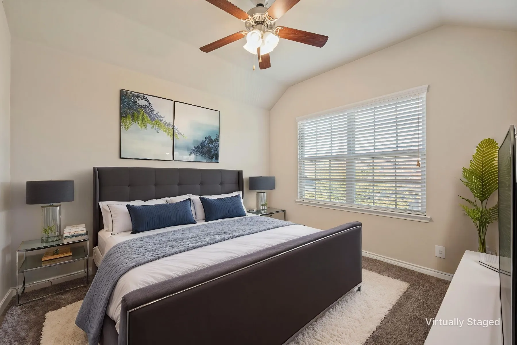 Vaulted ceiling, ceiling fan, carpeted flooring, window with blinds, and neutral wall tones