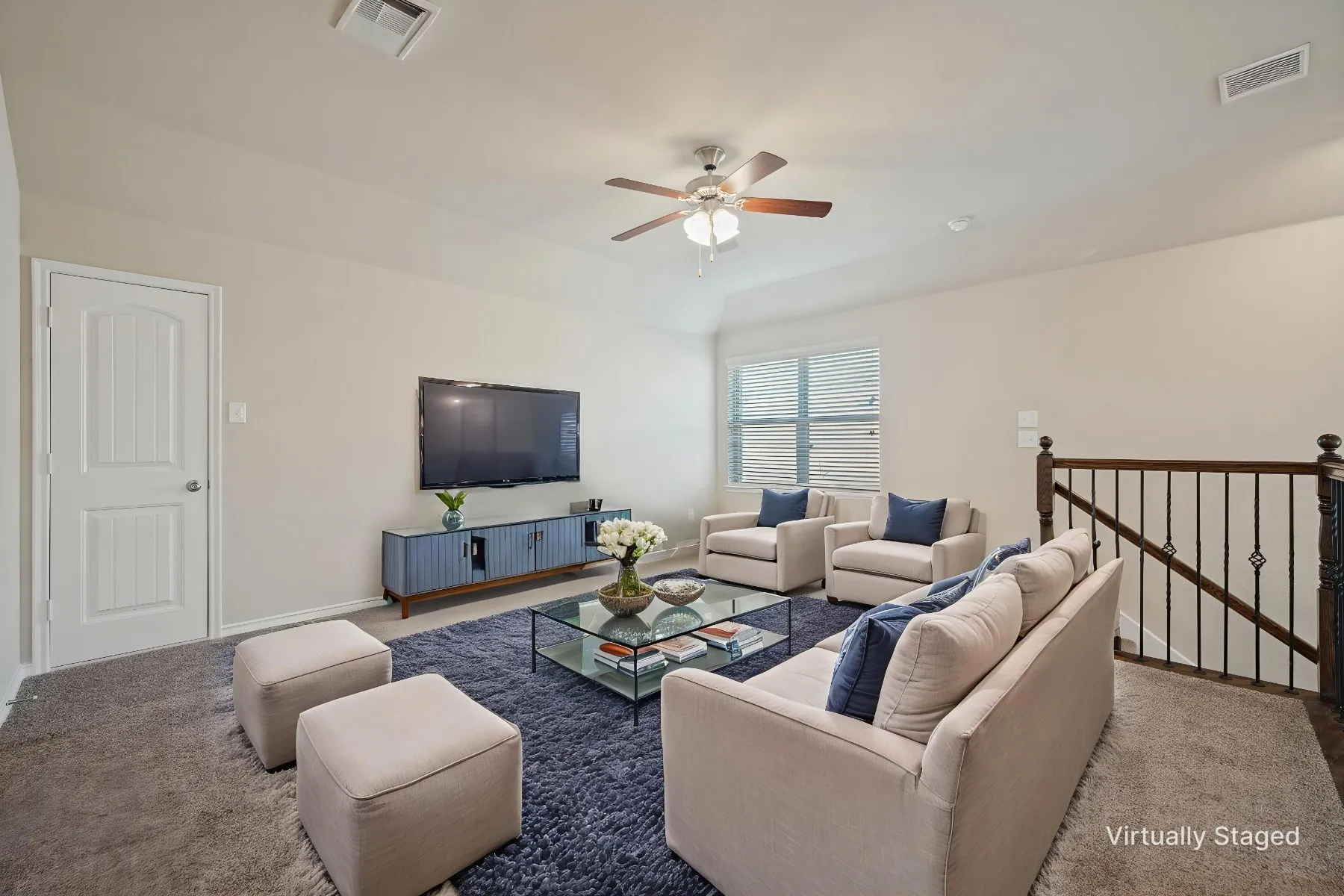 Recessed lighting, ceiling fan, carpet flooring, windows with blinds, and wrought iron railing