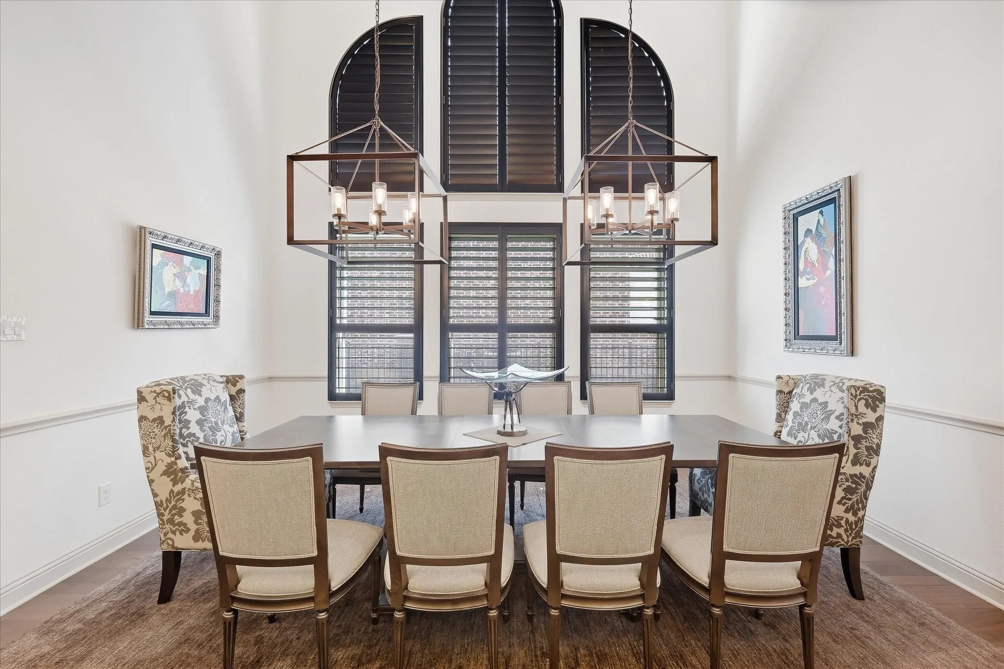 Soaring vaulted ceilings, wood  flooring, and crown molding