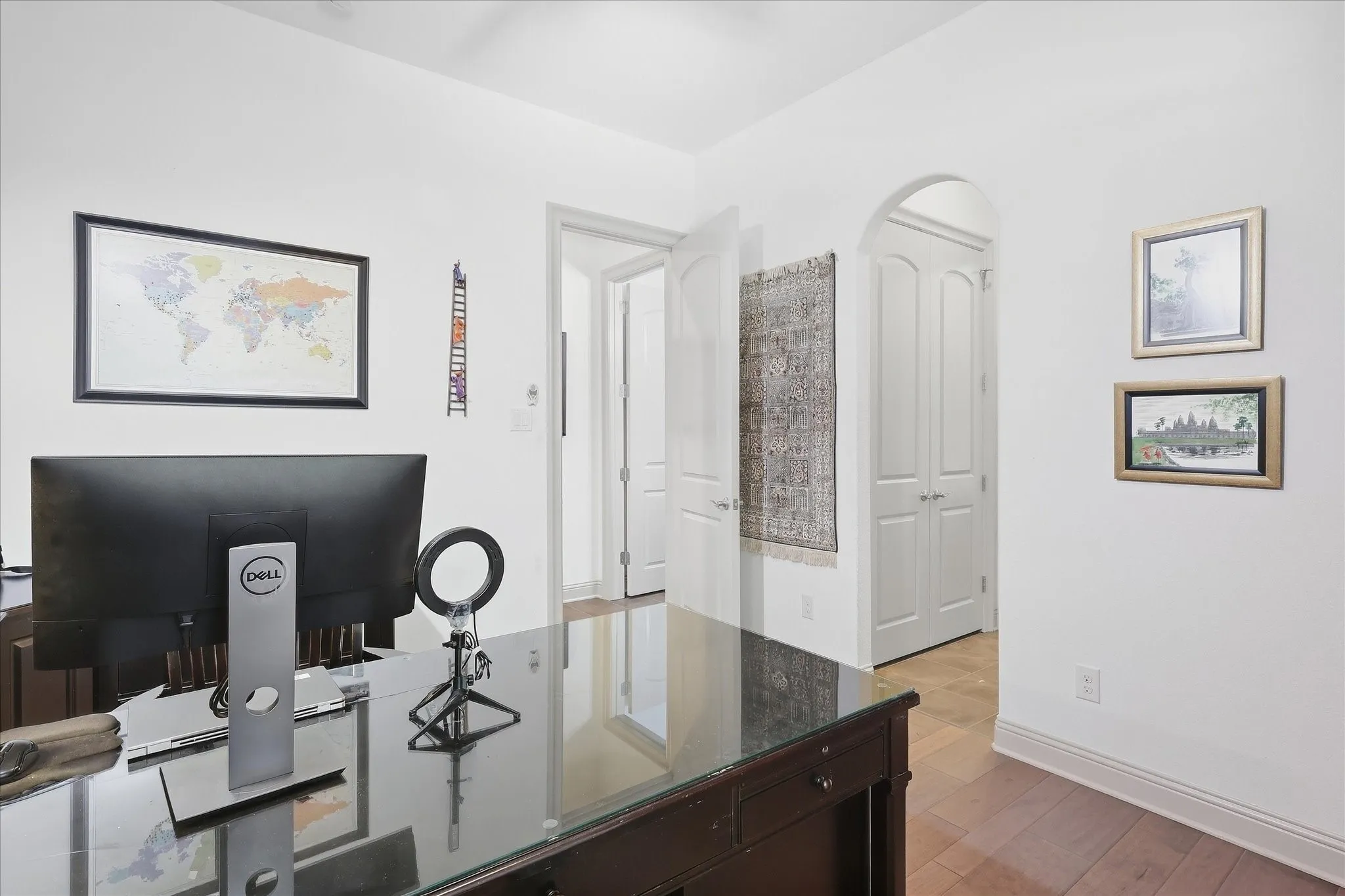 Wood flooring with white walls and trim