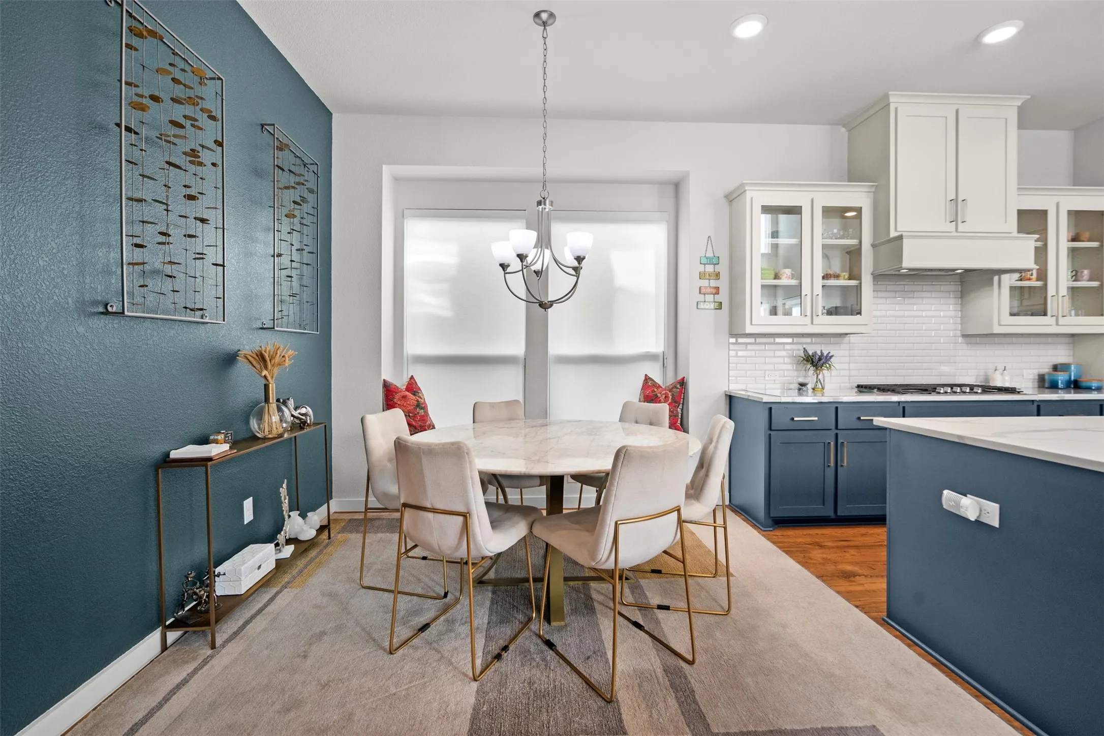 Kitchen featuring two-tone cabinetry with white upper cabinets and navy lower cabinets, white subway tile backsplash, and recessed lighting