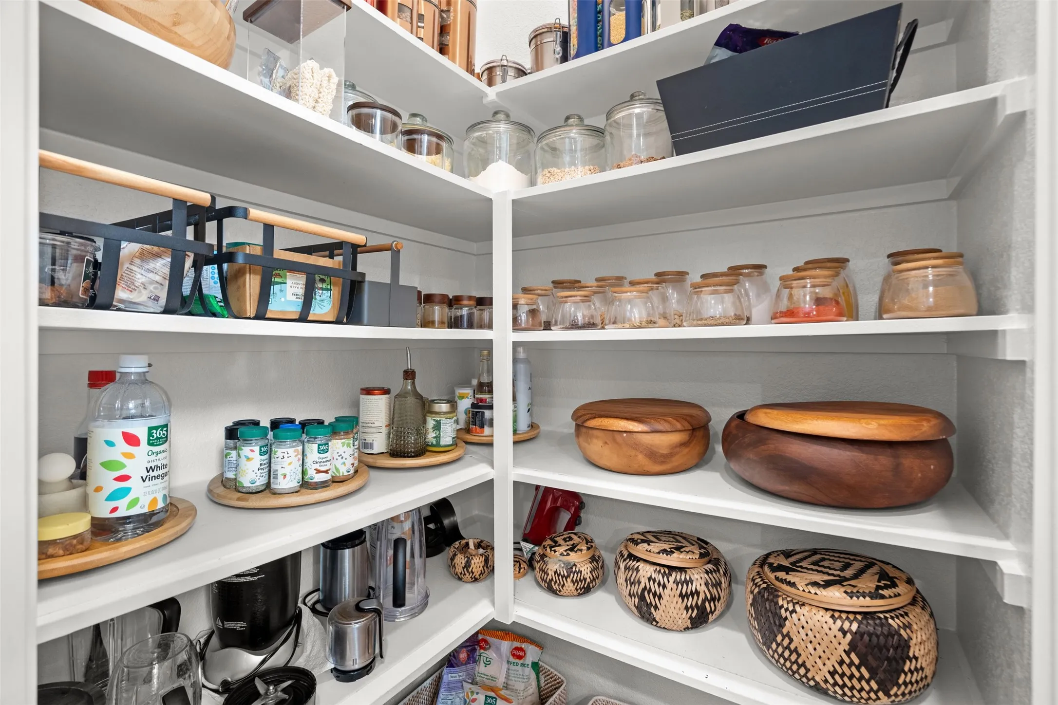 Corner pantry with white shelving