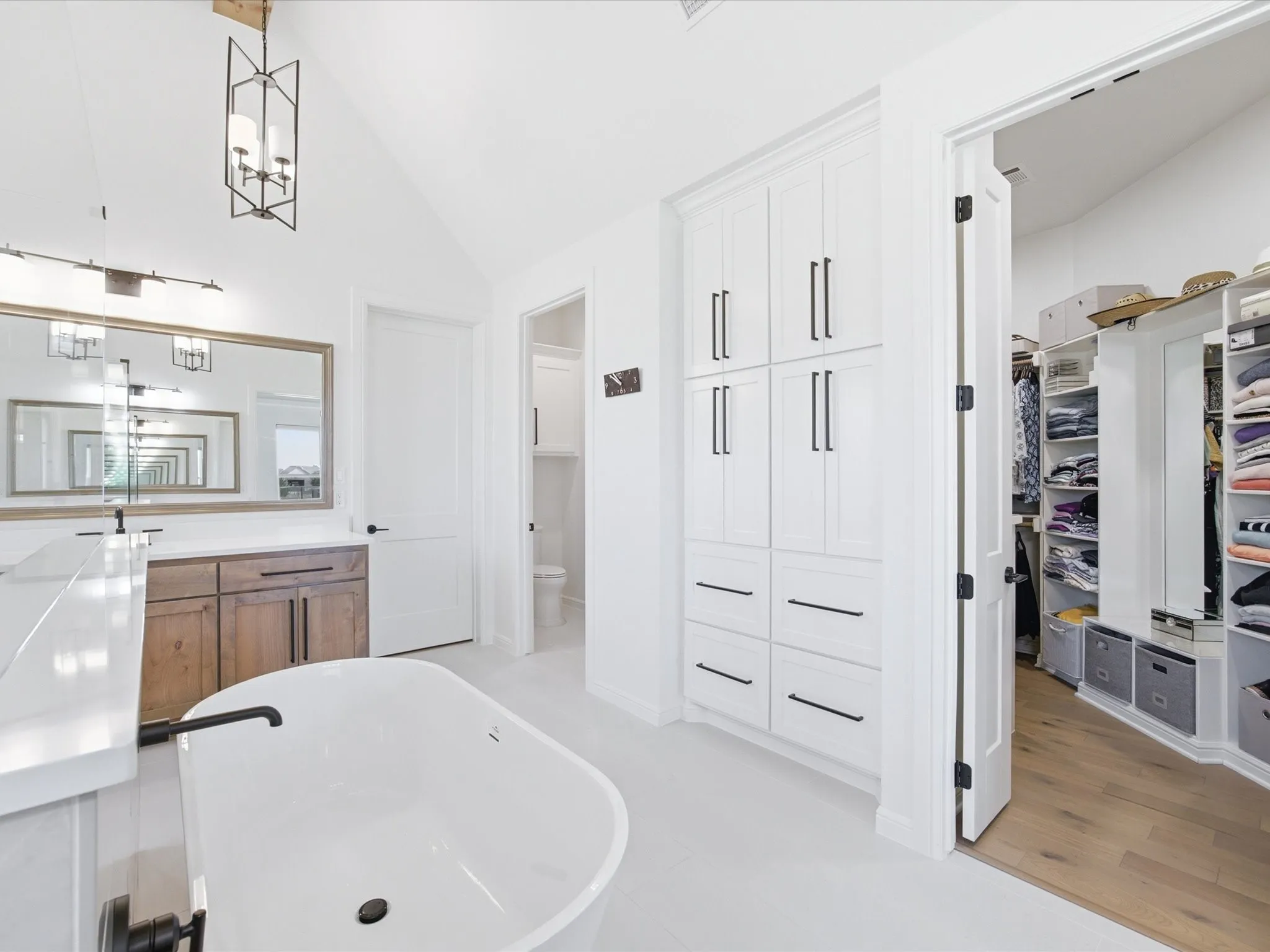 The ensuite bath connects to the large walk-in closet.