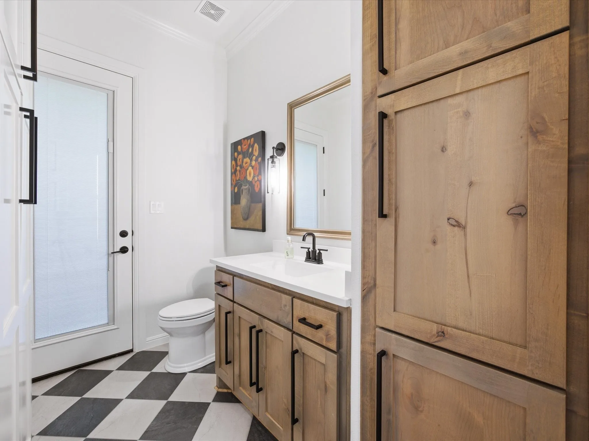 A wonderful half bath provides convenience for visiting guests.