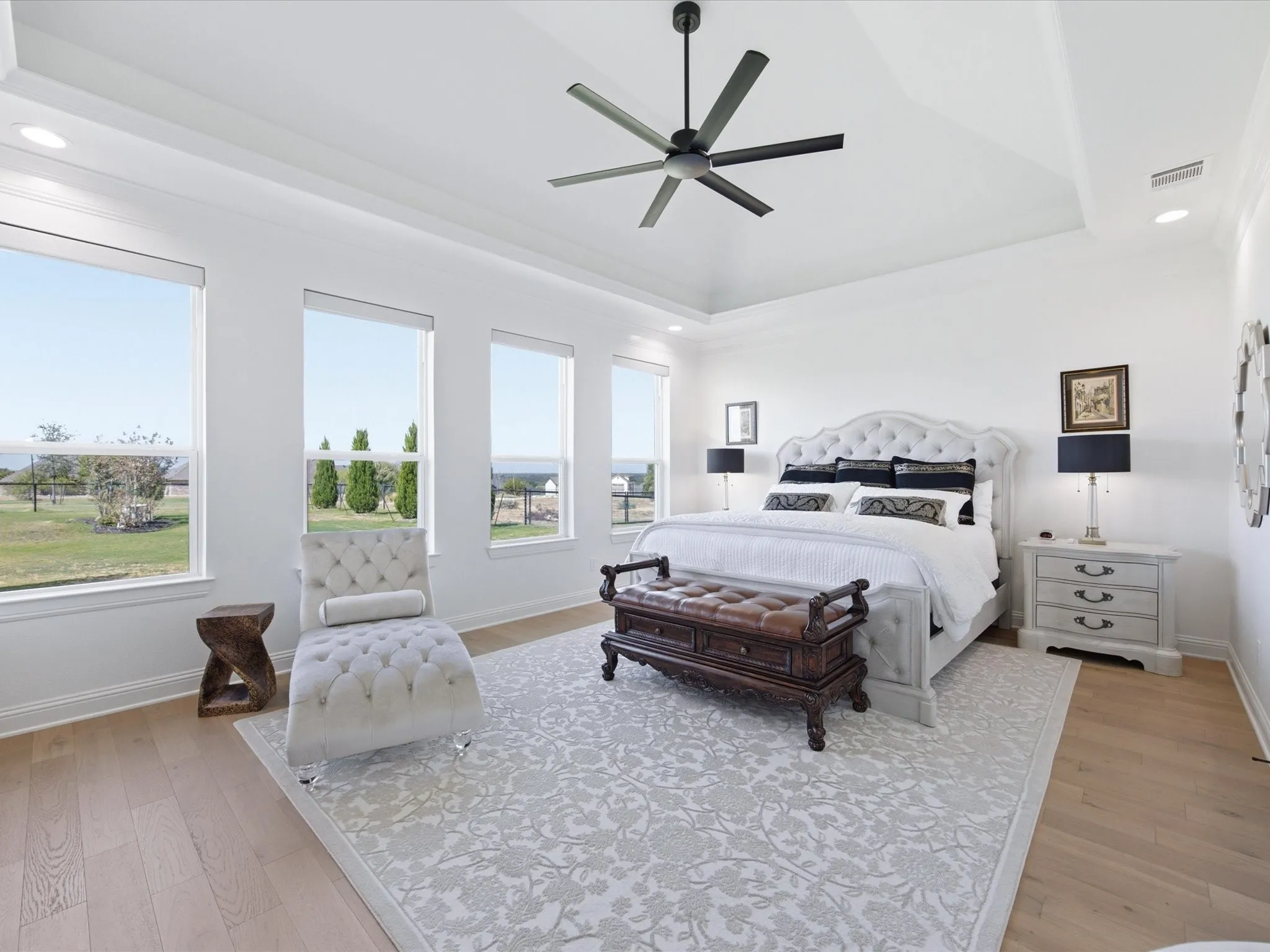 The primary bedroom is thoughtfully positioned in the back of the home and offers ample privacy from the secondary bedrooms.