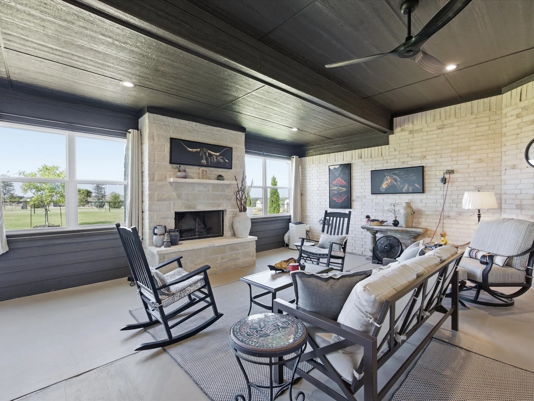 Designed for year-round enjoyment, the enclosed patio provides a comfortable space to
relax and unwind with a fireplace and portable heating and cooling unit.