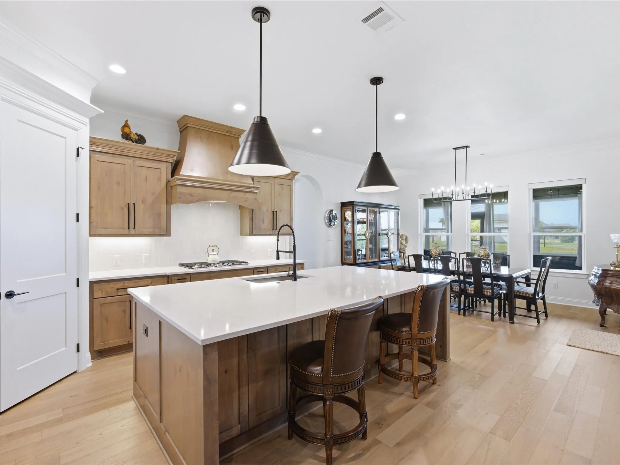 The large island offers additional prep space and casual seating.