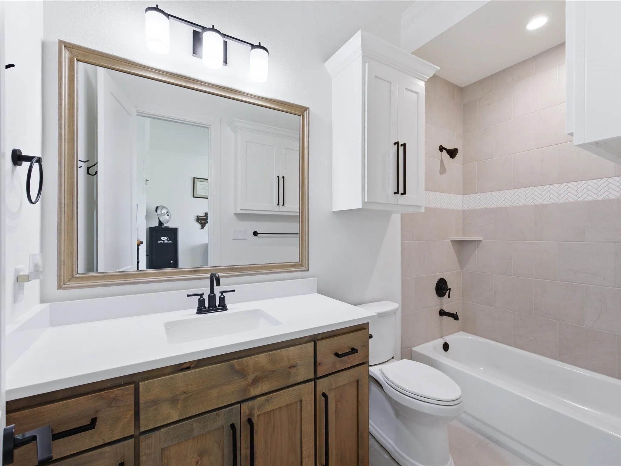 The secondary primary bedroom has access to a private ensuite bath.